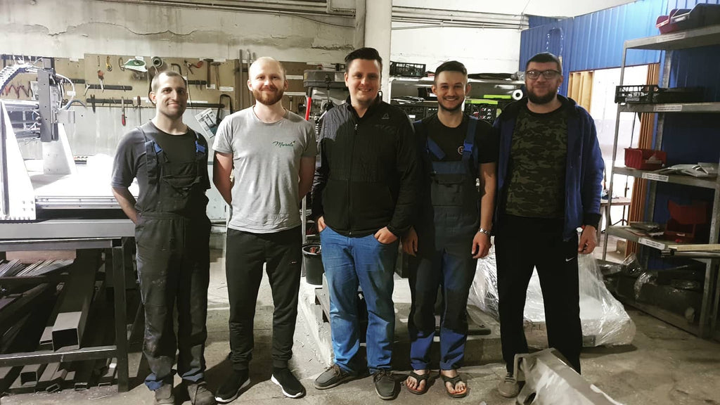 Sviatoslav Syvash with the engineering team that built the first CNC machine for Mureli's production