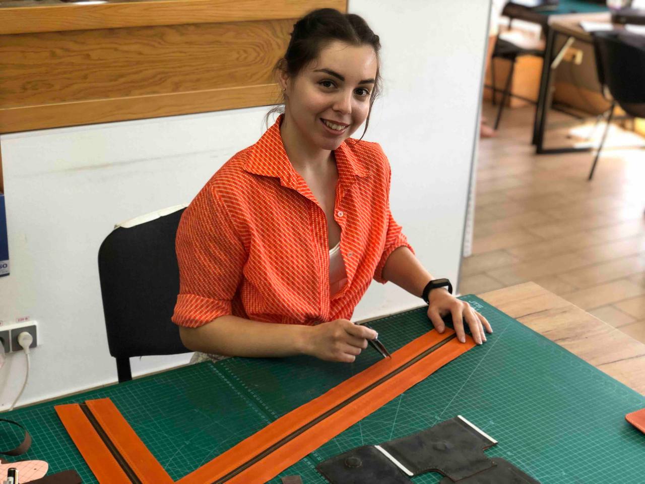 Marianna Hordynska working on a new leather item at the Mureli workshop, Zakarpattia, 2022