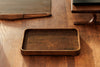Flatlay of green tray with modern accessories