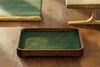 Inspirational quote engraved on desk tray