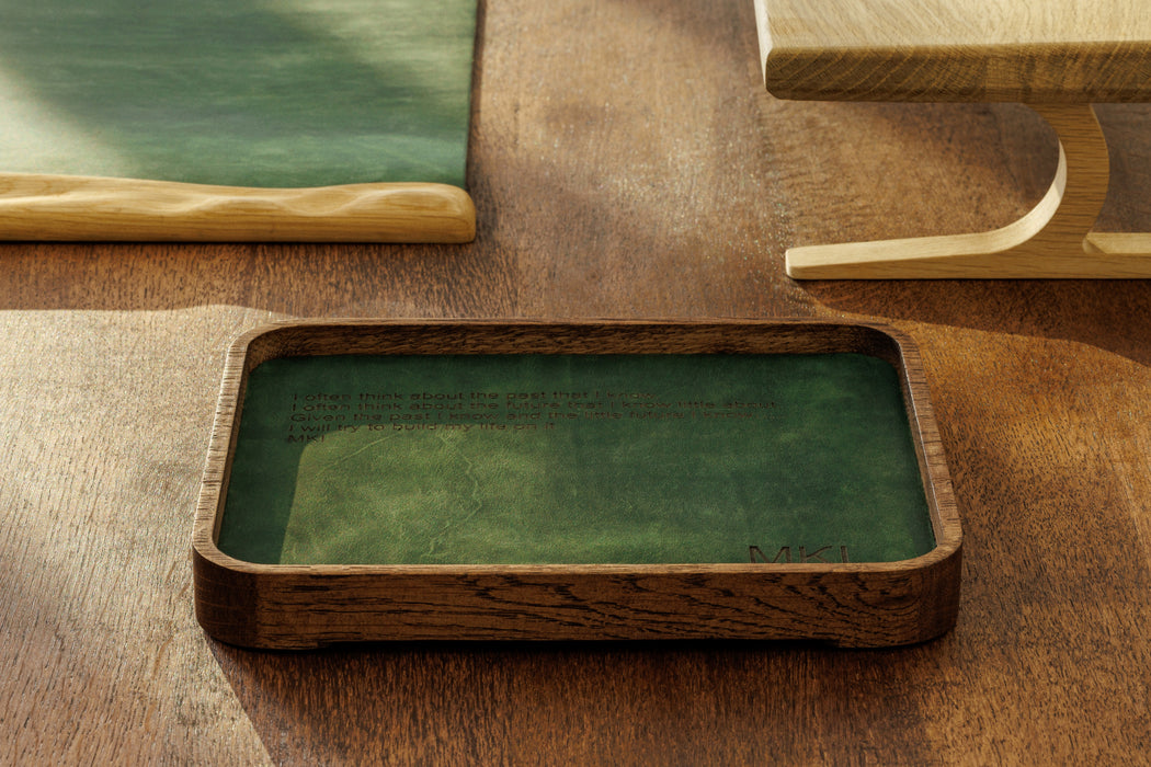 Inspirational quote engraved on desk tray