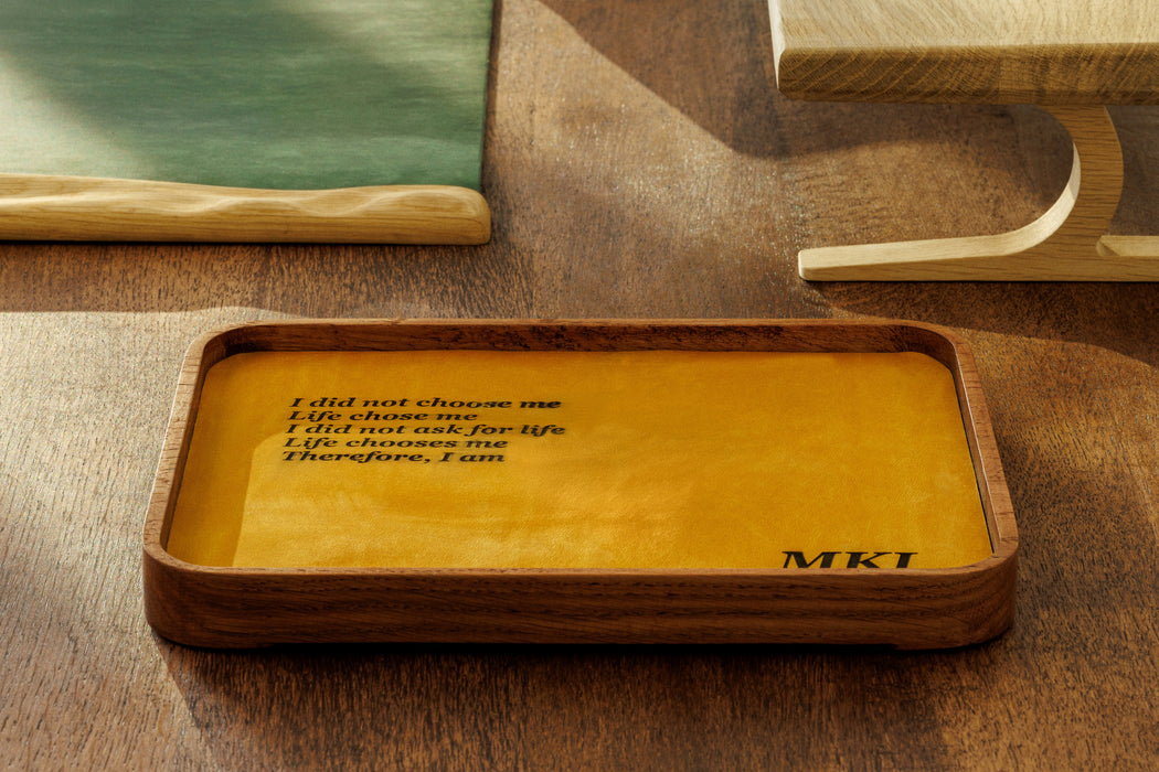 Set of wooden trays with different leather colors