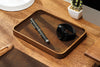 Desktop essentials arranged on premium leather tray