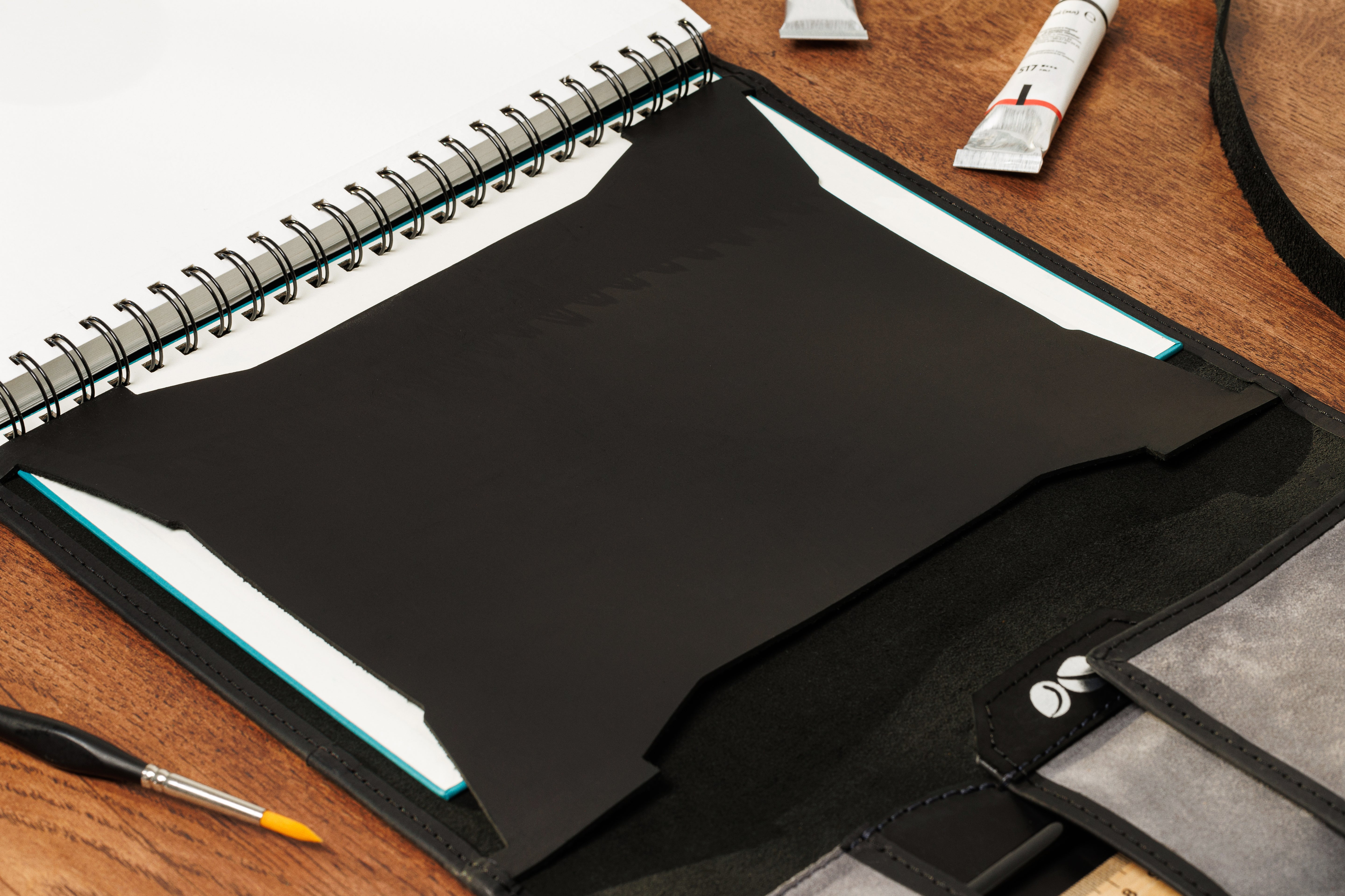 Contemporary style black and gray leather sketchbook case