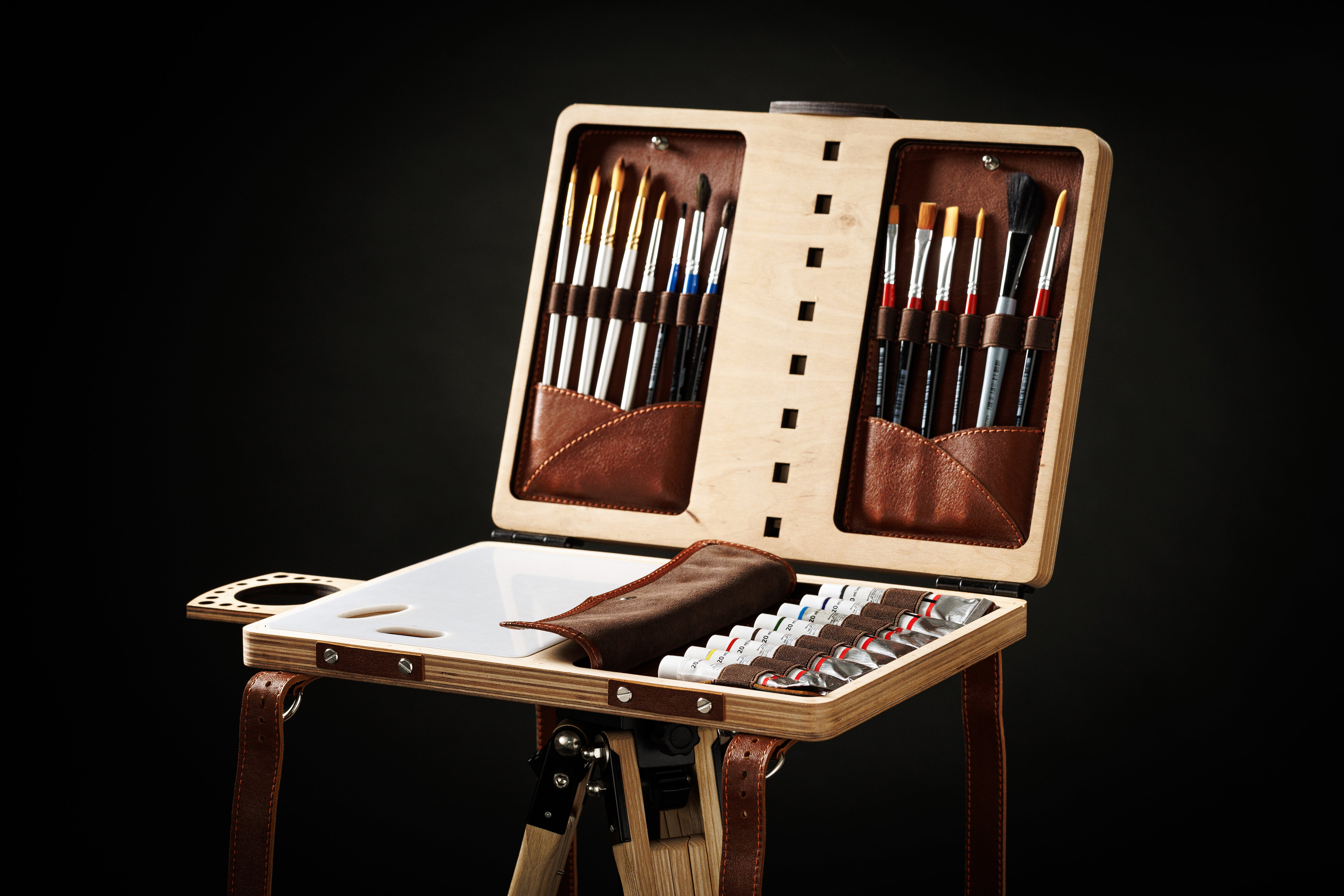 Open painting organizer showing brush storage