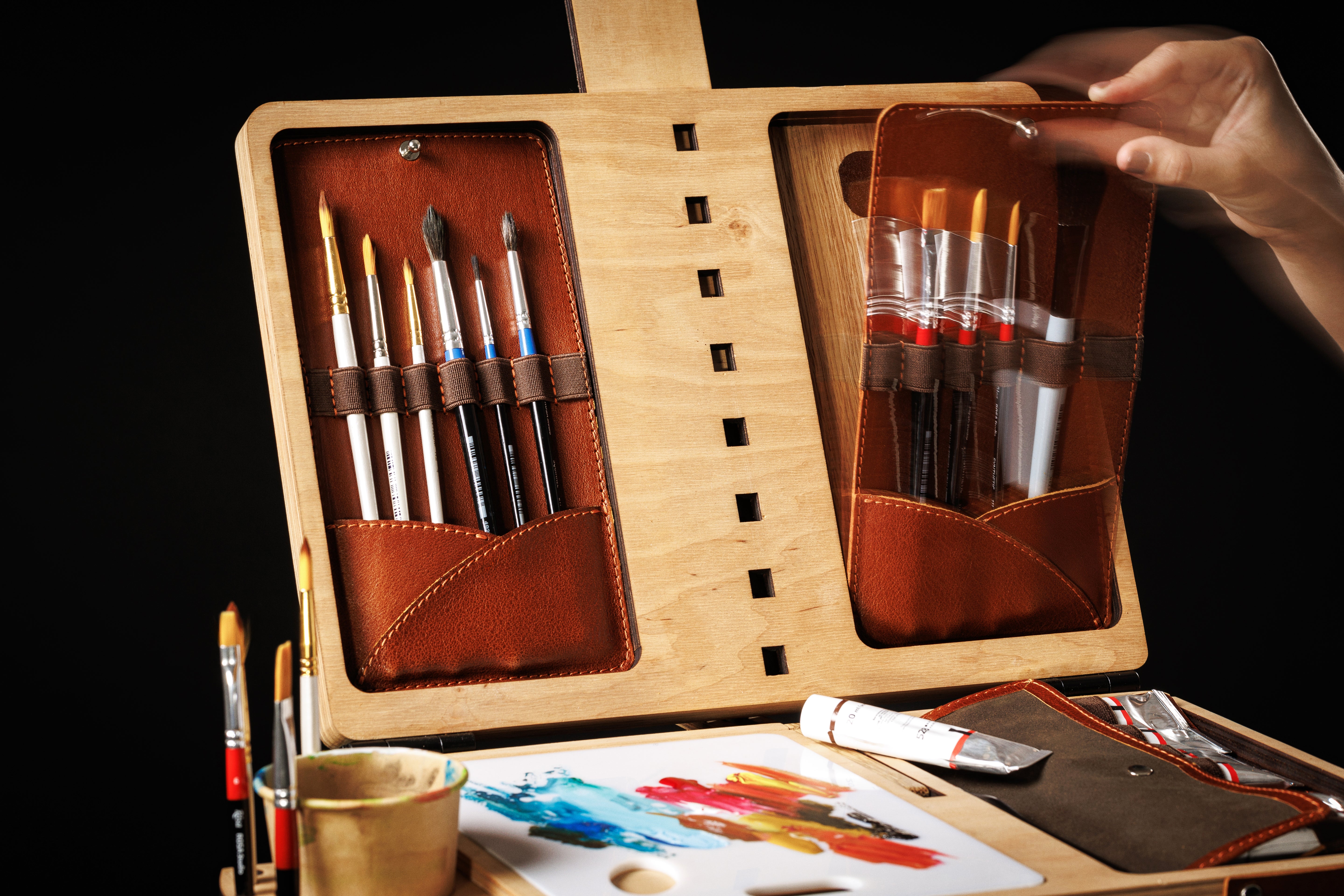 Painting case with sliding water cup holder