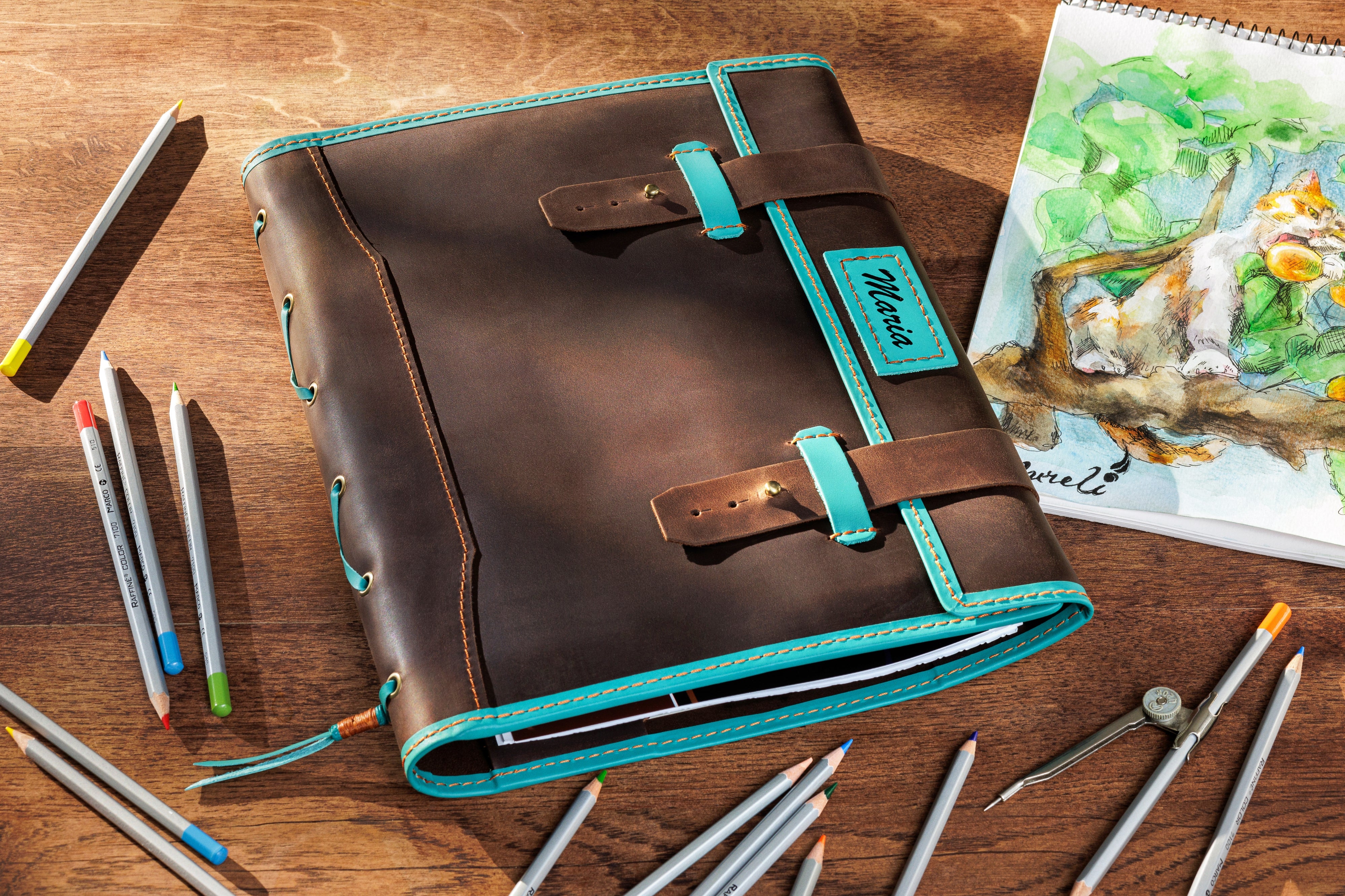 Brown leather sketchbook with turquoise straps and stitching — personalized artist organizer by Mureli