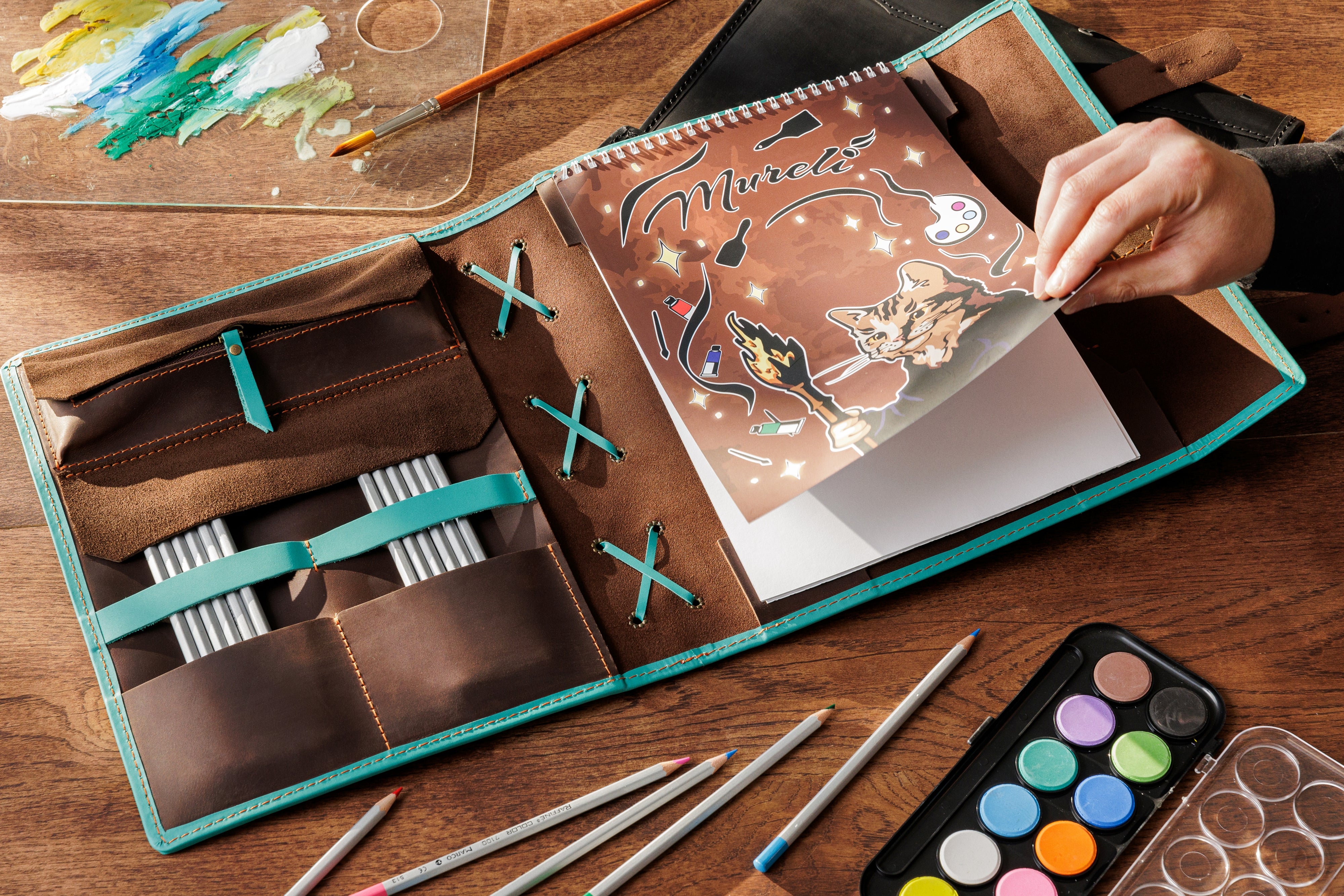 Handmade Crazy Horse leather sketchbook in dark brown with bright turquoise trim — refillable and personalized
