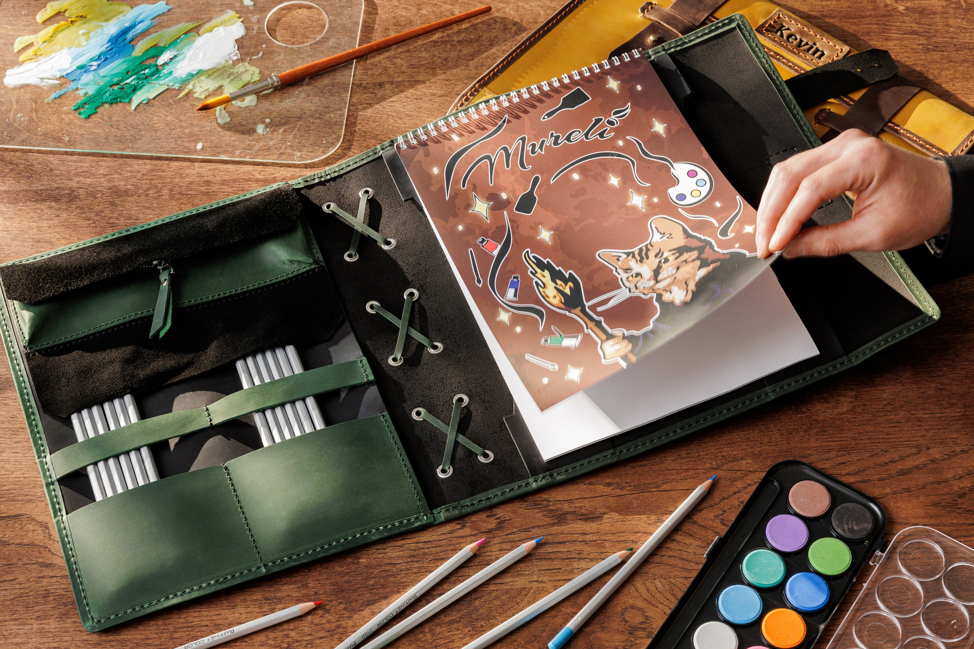 Art organizer opened on desk with colored pencils and sketchpad – forest green and black leather by Mureli