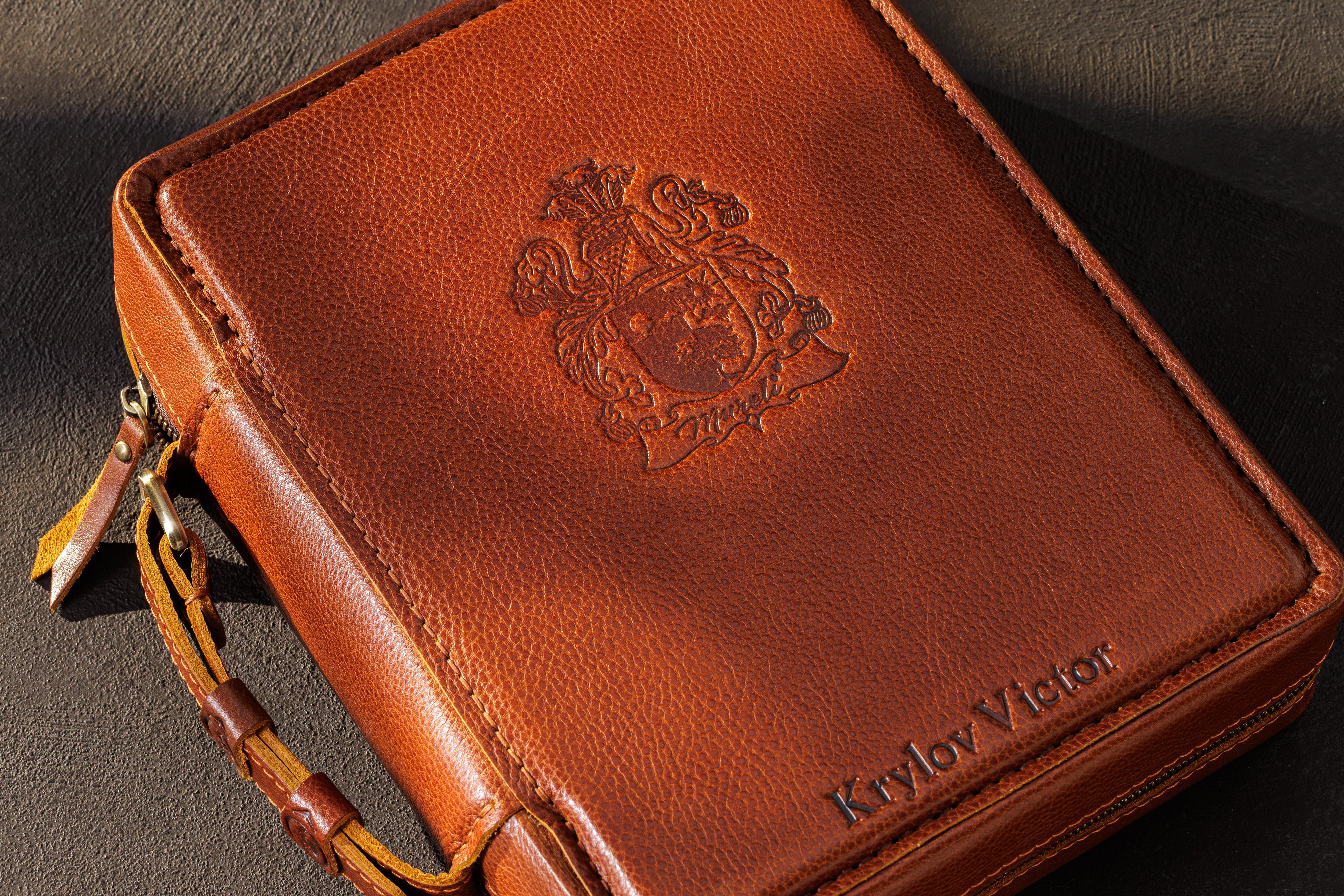 Personalized camel leather cash organizer with embossed crest, custom name and zip-around closure
