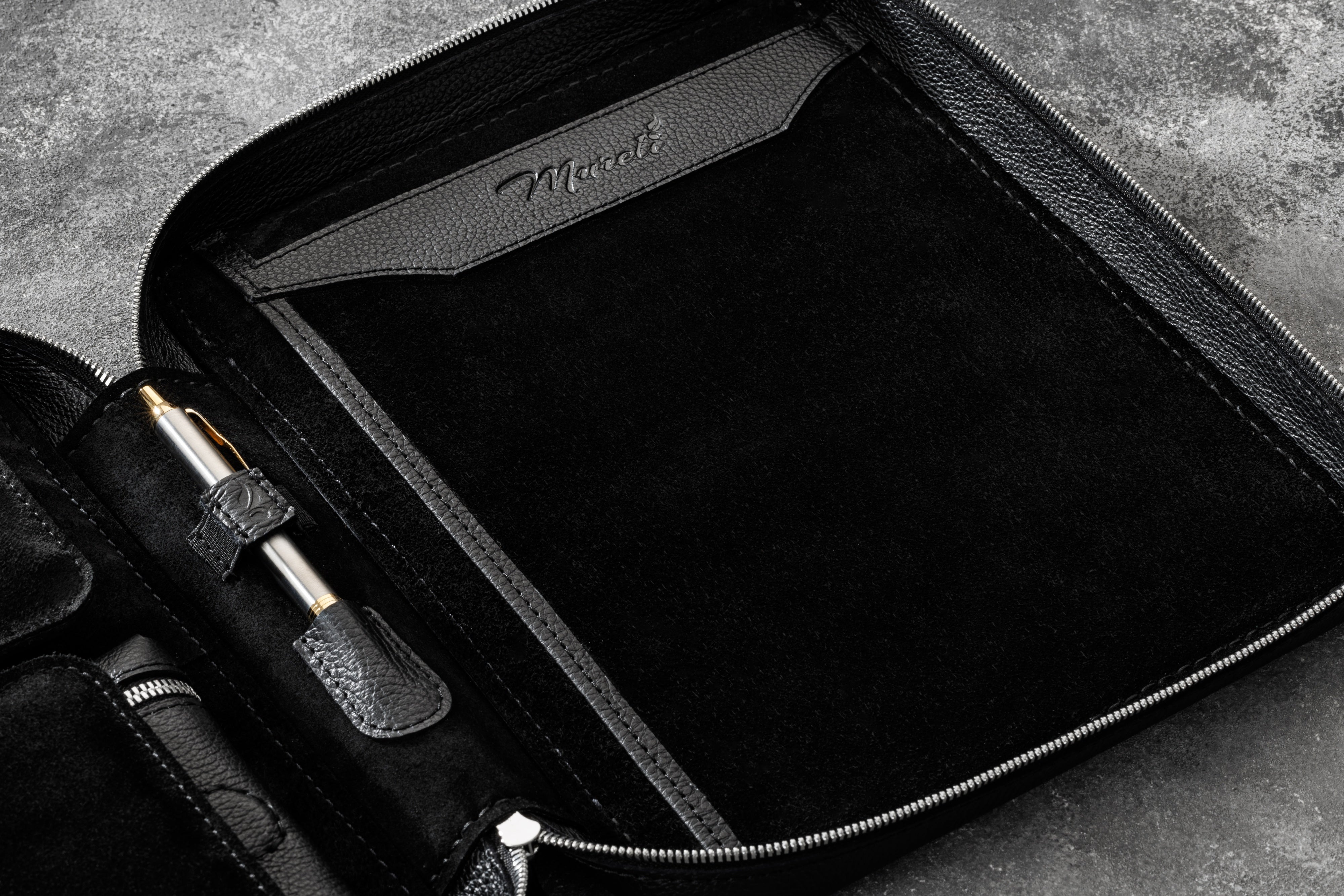 Close-up of Leather Pen Holder and Notebook Section