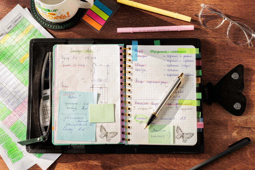 Personalized black leather organizer with embossed name.