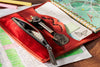 Mureli red leather butterfly clasp organizer, flipping sketchbook pages
