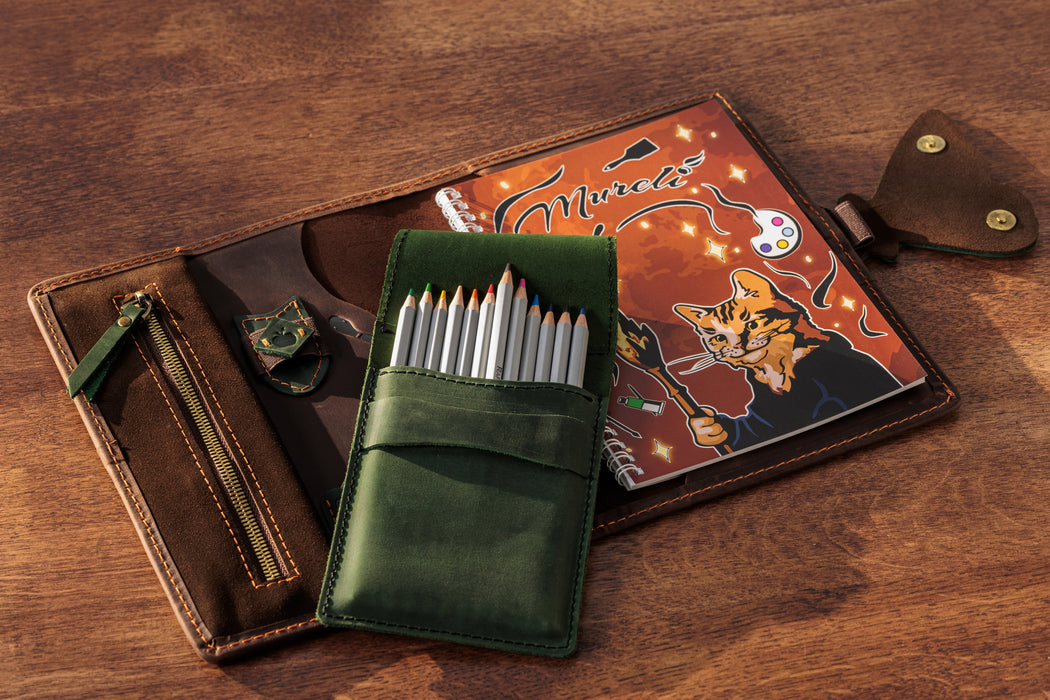 Leather organizer with butterfly clasp – inside view with sketchbook and notes