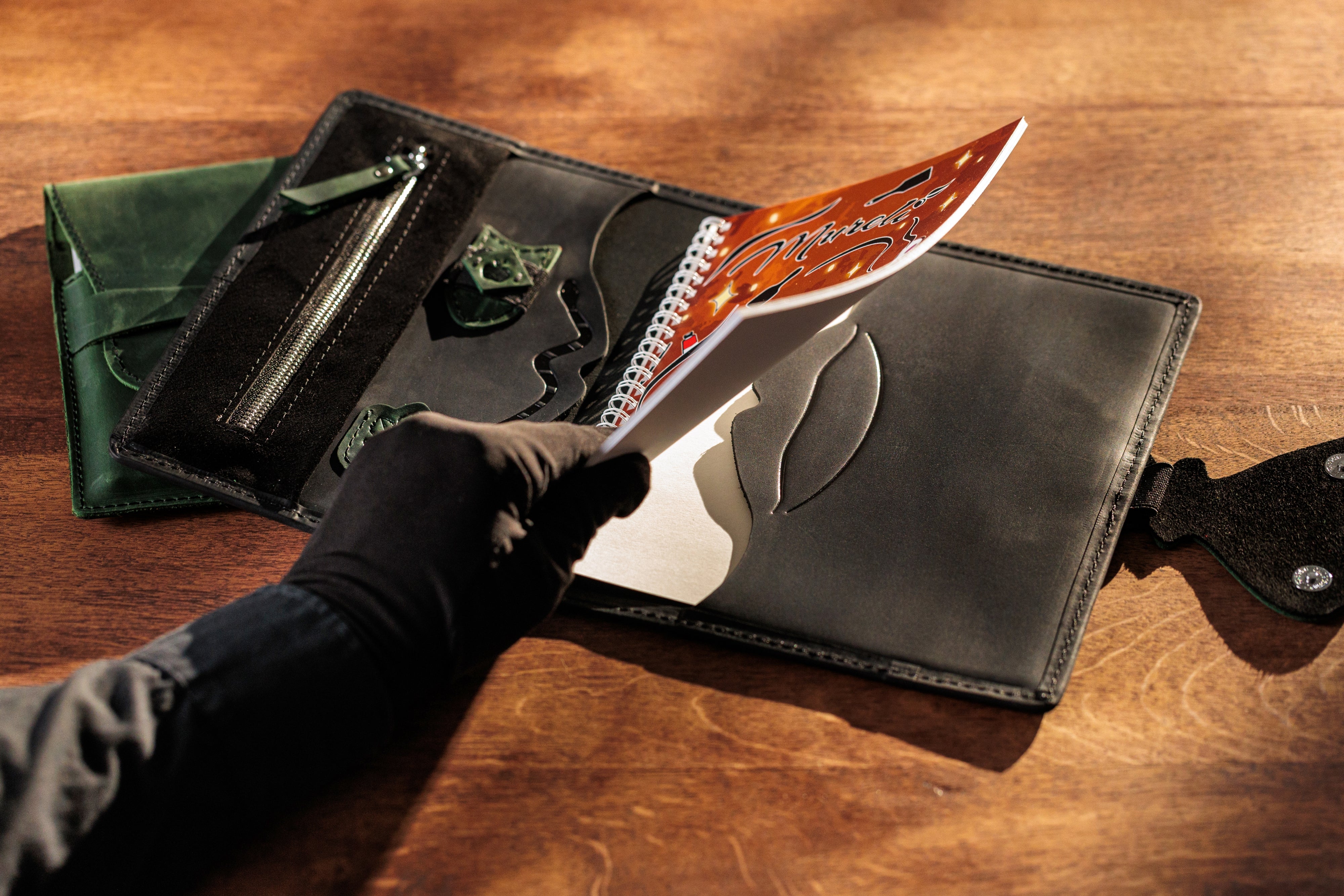 Black leather organizer with butterfly clasp – open with sketchbook.