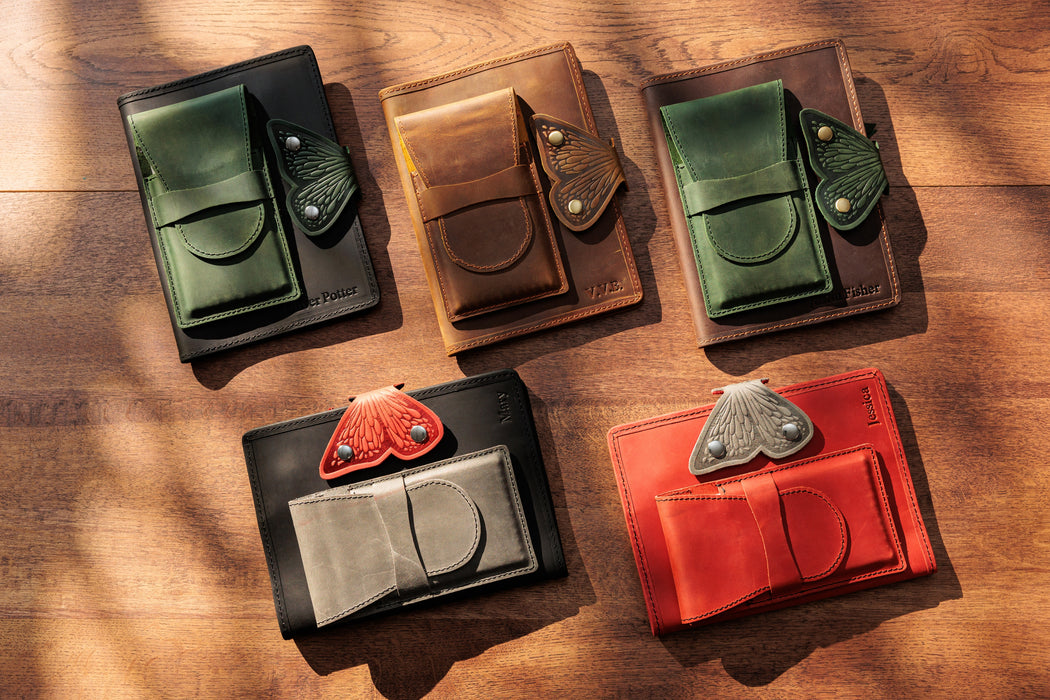 Collection of leather notebook organizers in various colors by Mureli
