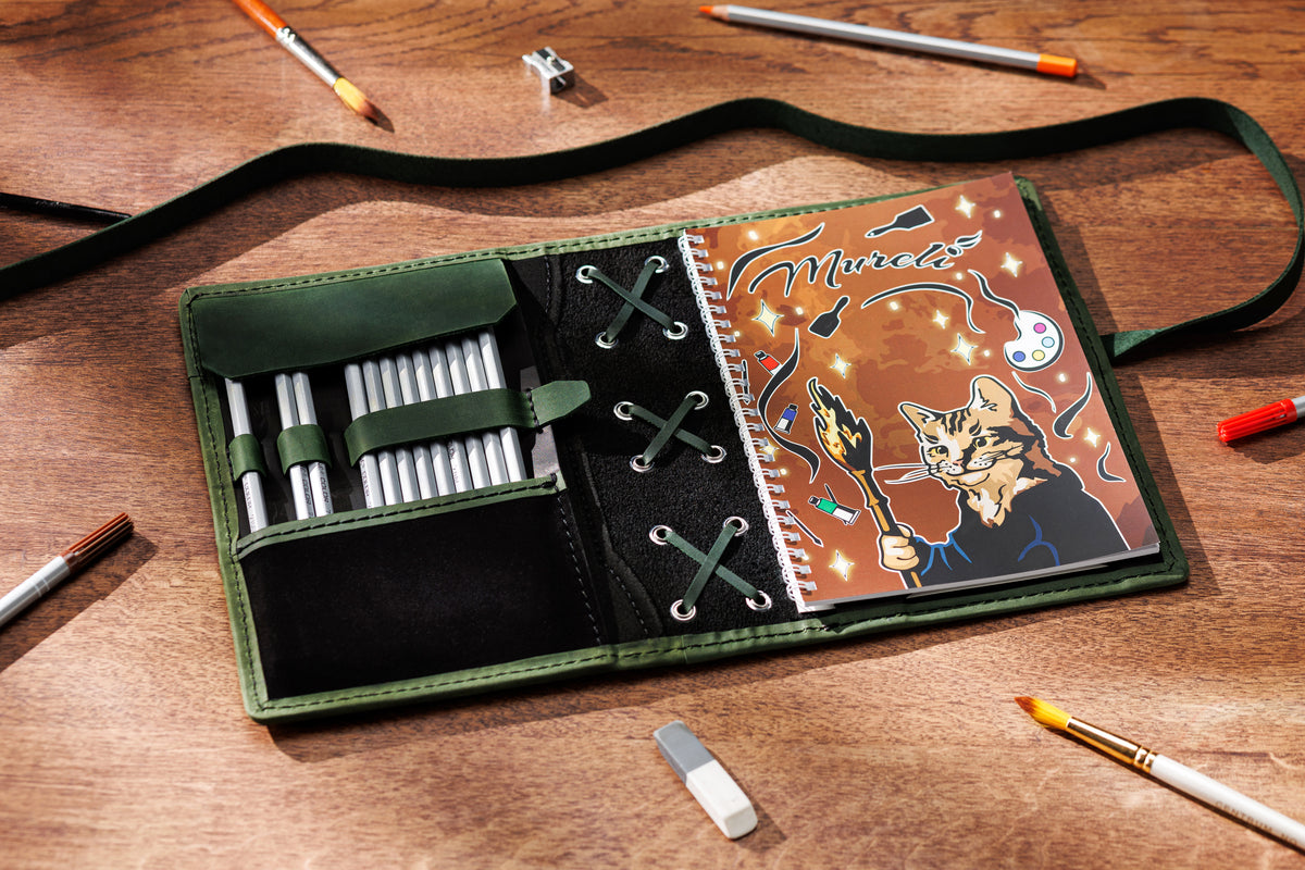 black and olive green leather sketchbook organizer for A5 and 8.5 x 5.5 notebooks with pencils and spiral sketchbook