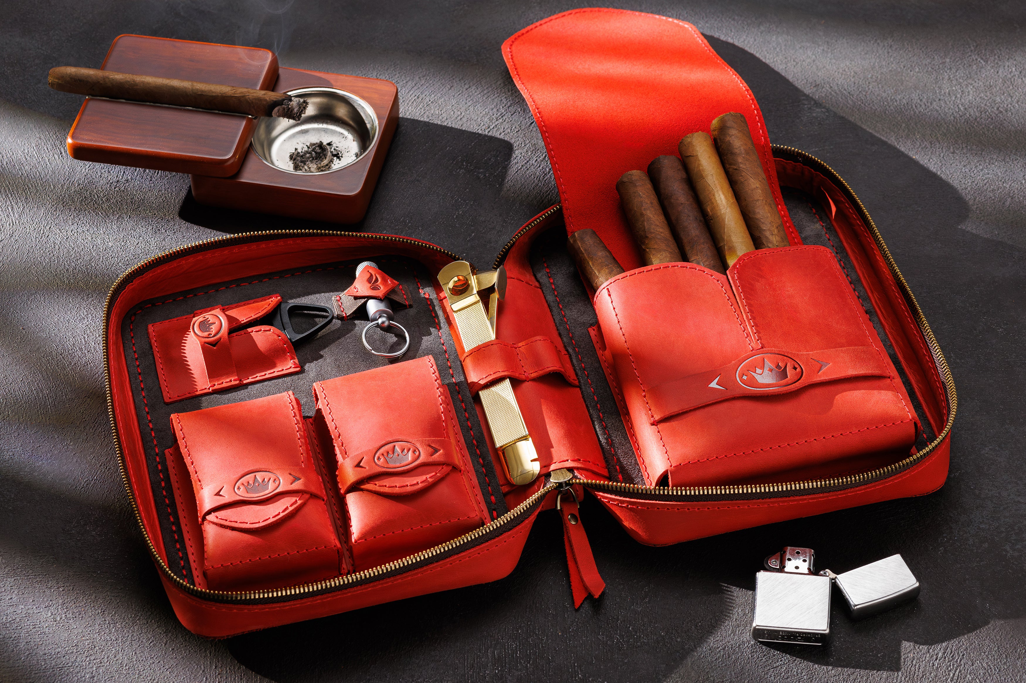 red leather cigar case with crown and handle