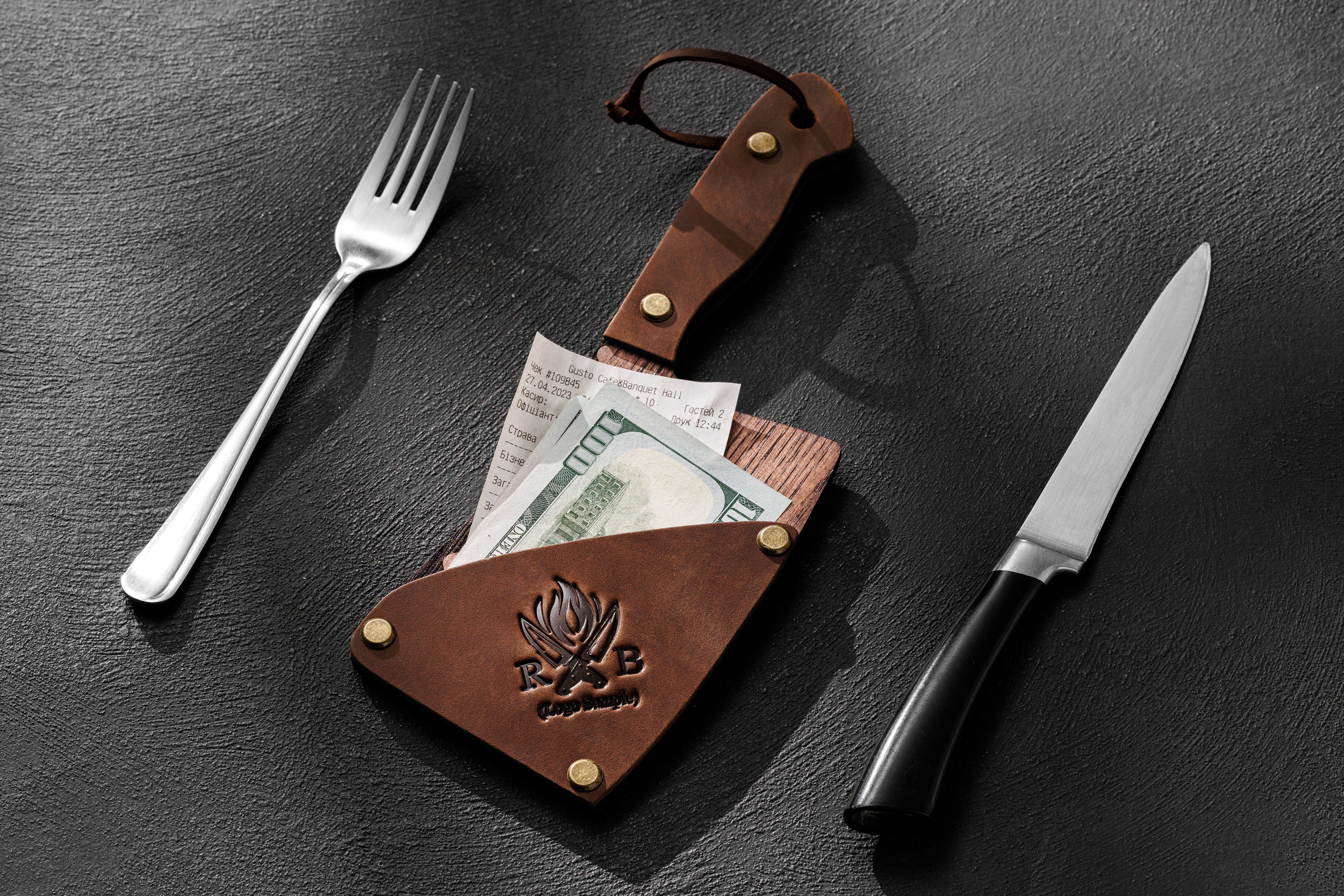 Knife shaped receipt folder for steakhouse setting