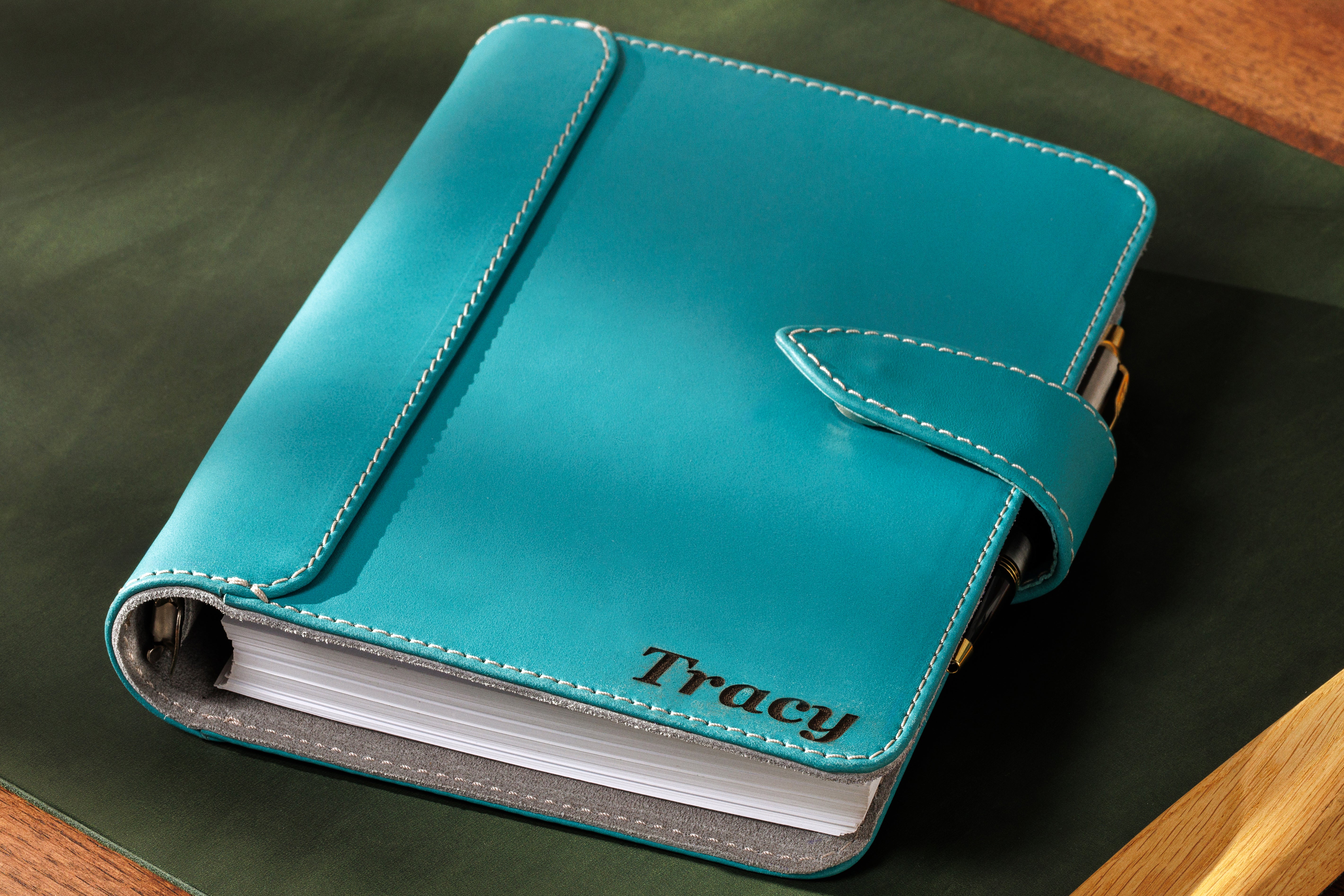 Sky blue leather business notebook Mureli with strap closure and engraved initials