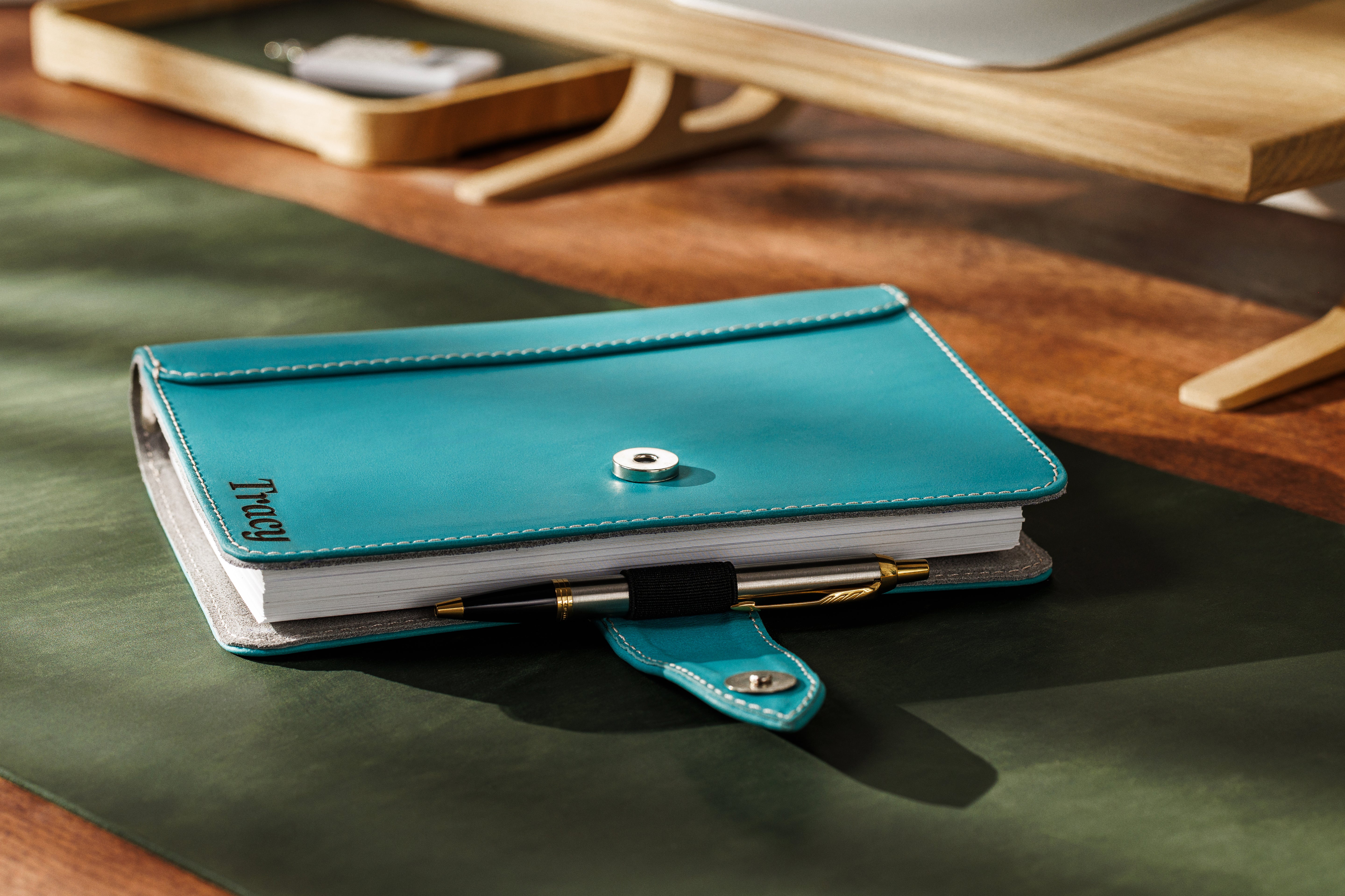 Close-up of sky blue full-grain leather texture with polished edges