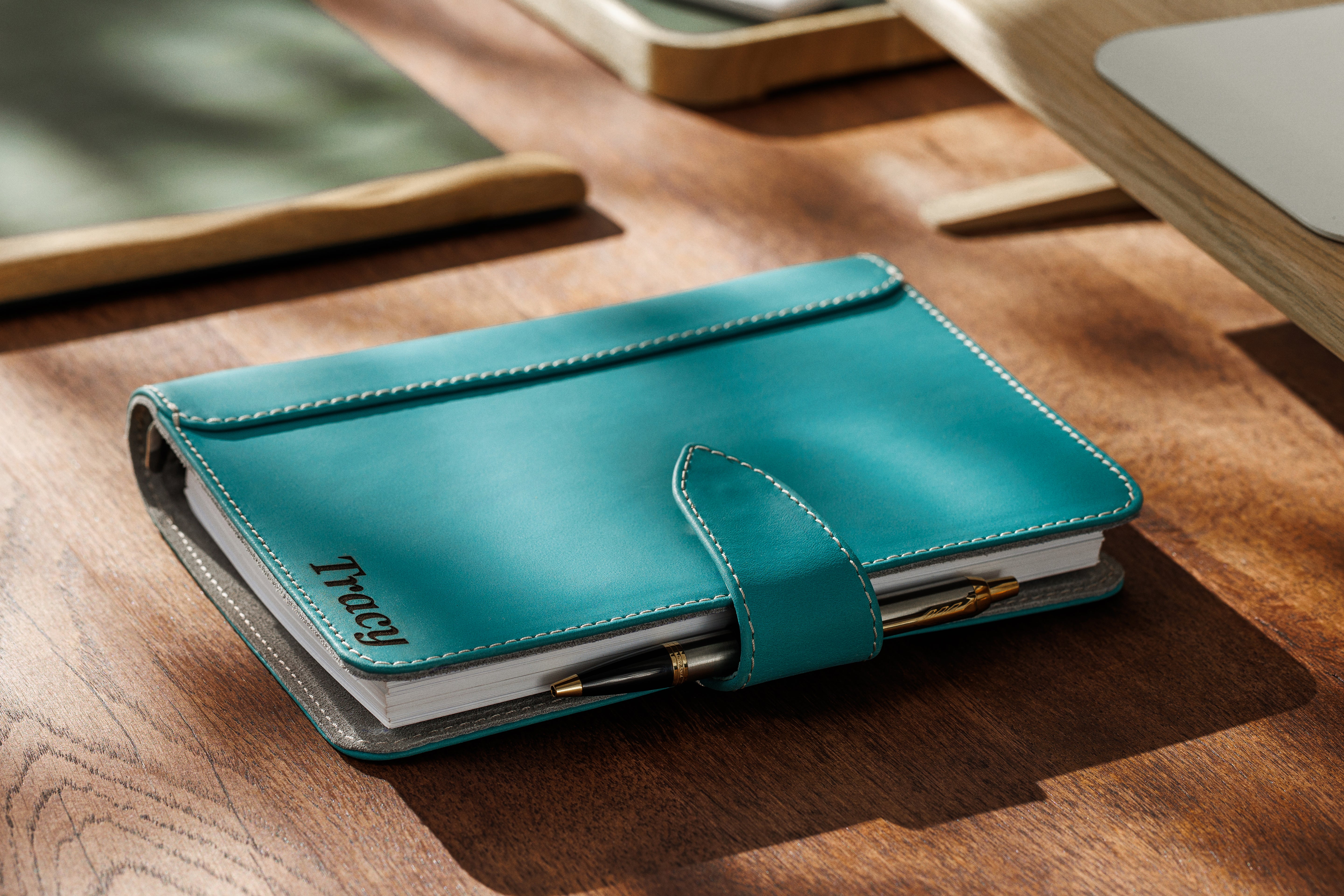 Handmade turquoise leather organizer with refillable pages and pen holder