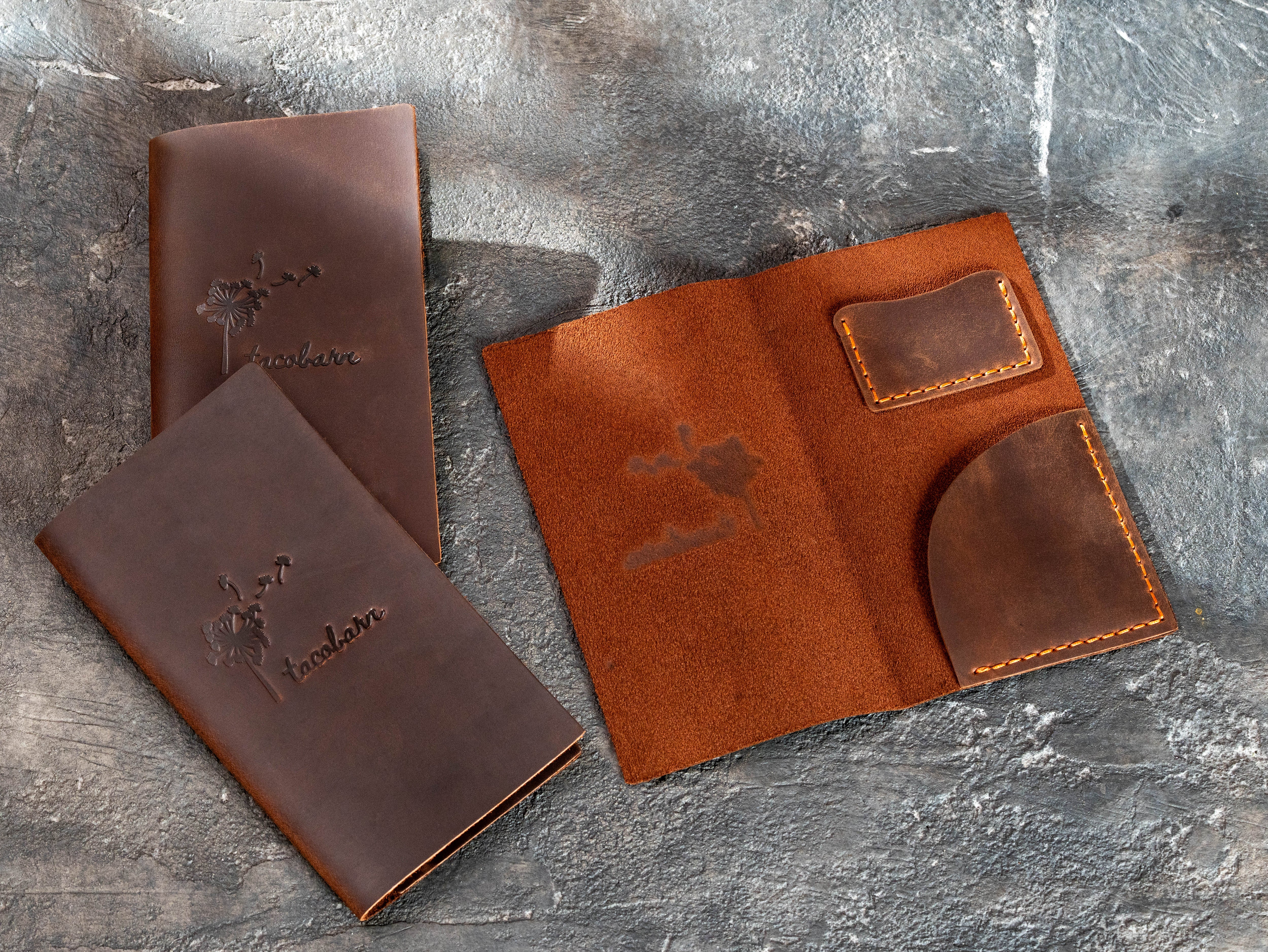 Custom brown leather Taco Bar check presenters arranged in a layered display