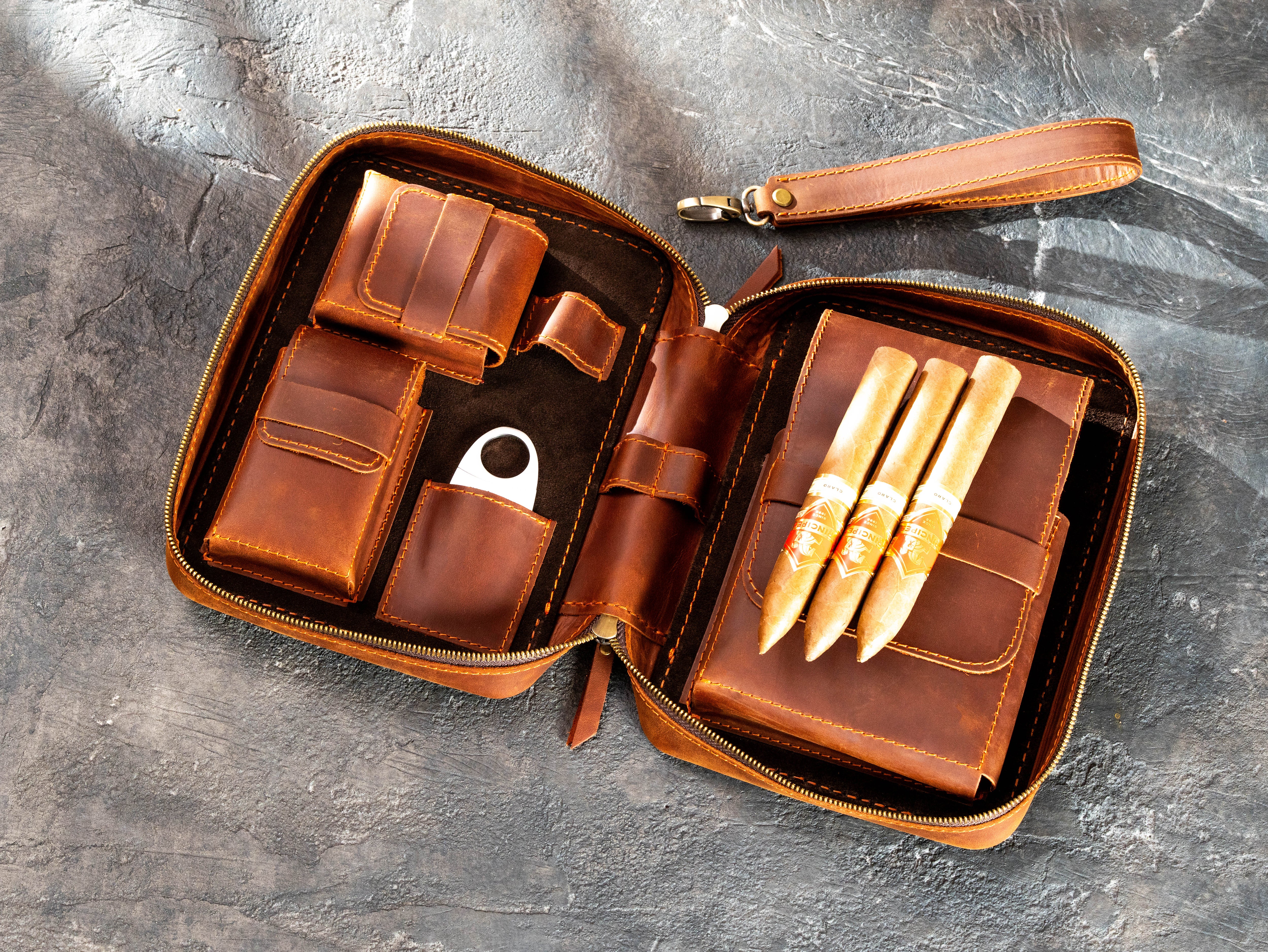 Open Copper Crazy Horse leather travel case with organized interior pockets, removable holder, and accessories