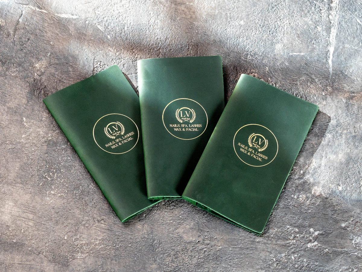 Set of three green leather bill holders with gold logo for beauty business