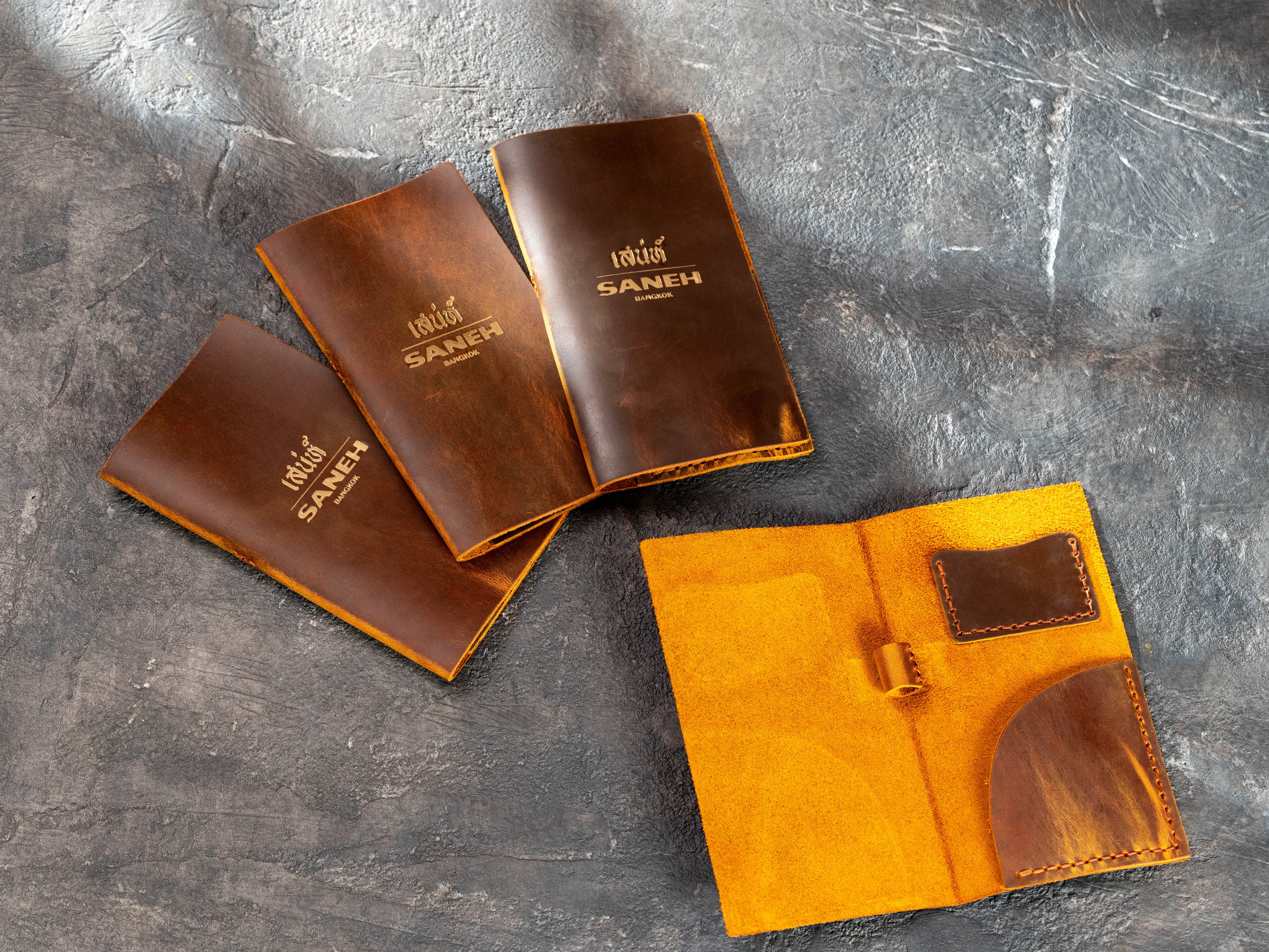 Chestnut Crazy Horse leather restaurant check presenters with card pocket, receipt pocket and pen loop