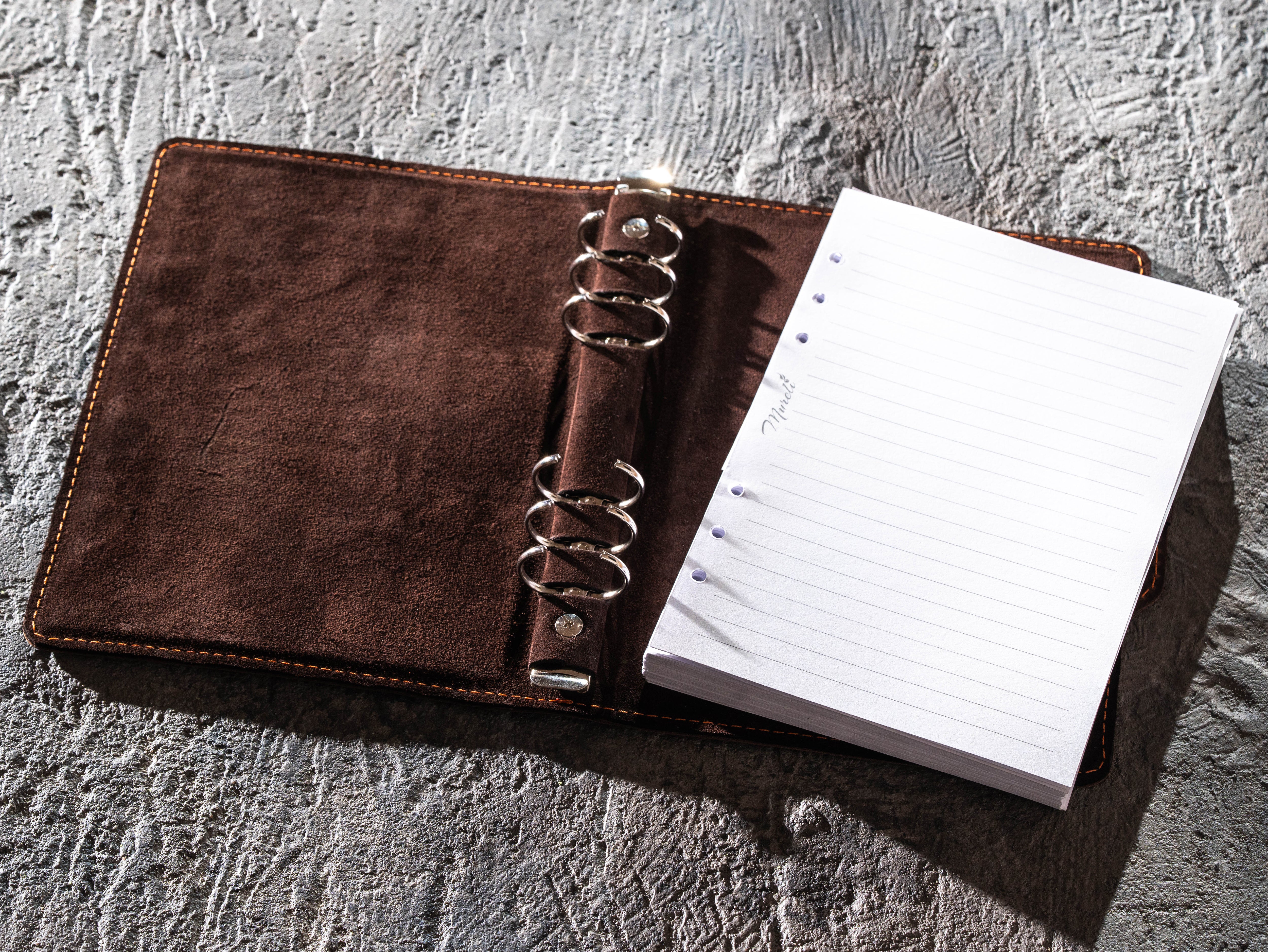 Open dark brown leather A5 six-ring binder notebook with removable lined paper