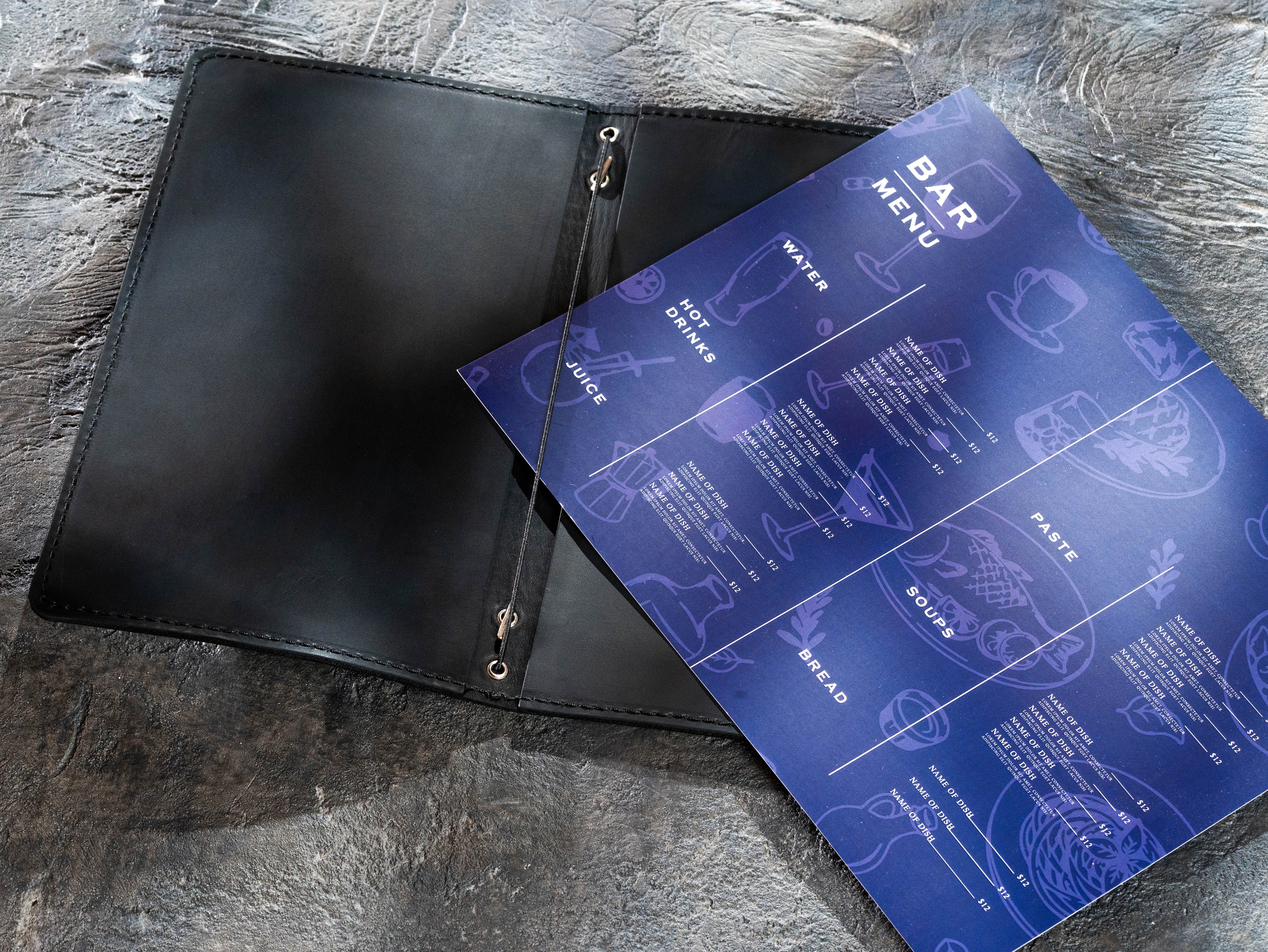 Black leather menu cover holding a removable bar menu sheet with elastic cord