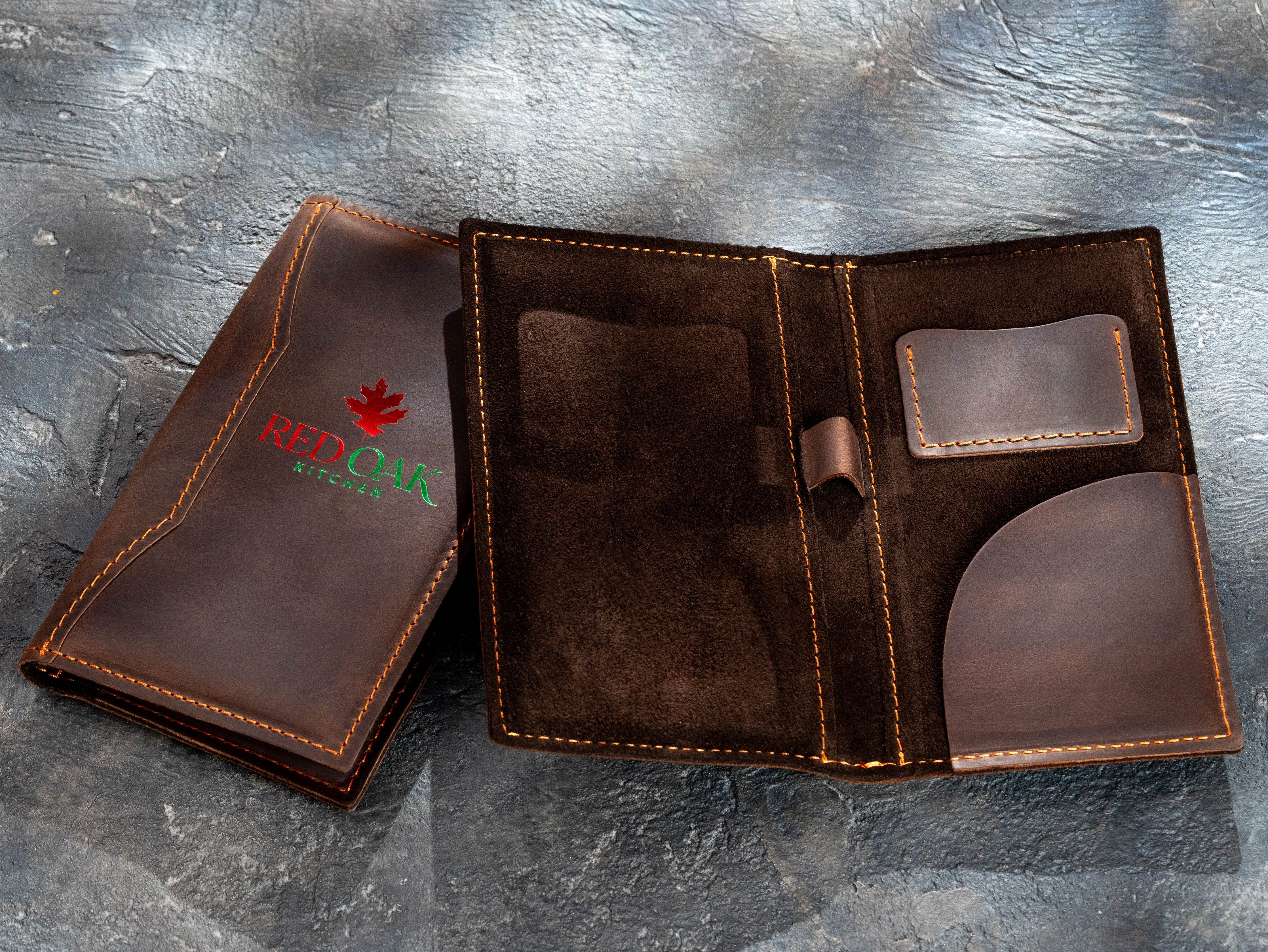 Brown leather check presenters with custom two-color red and green foil logo and interior pocket options
