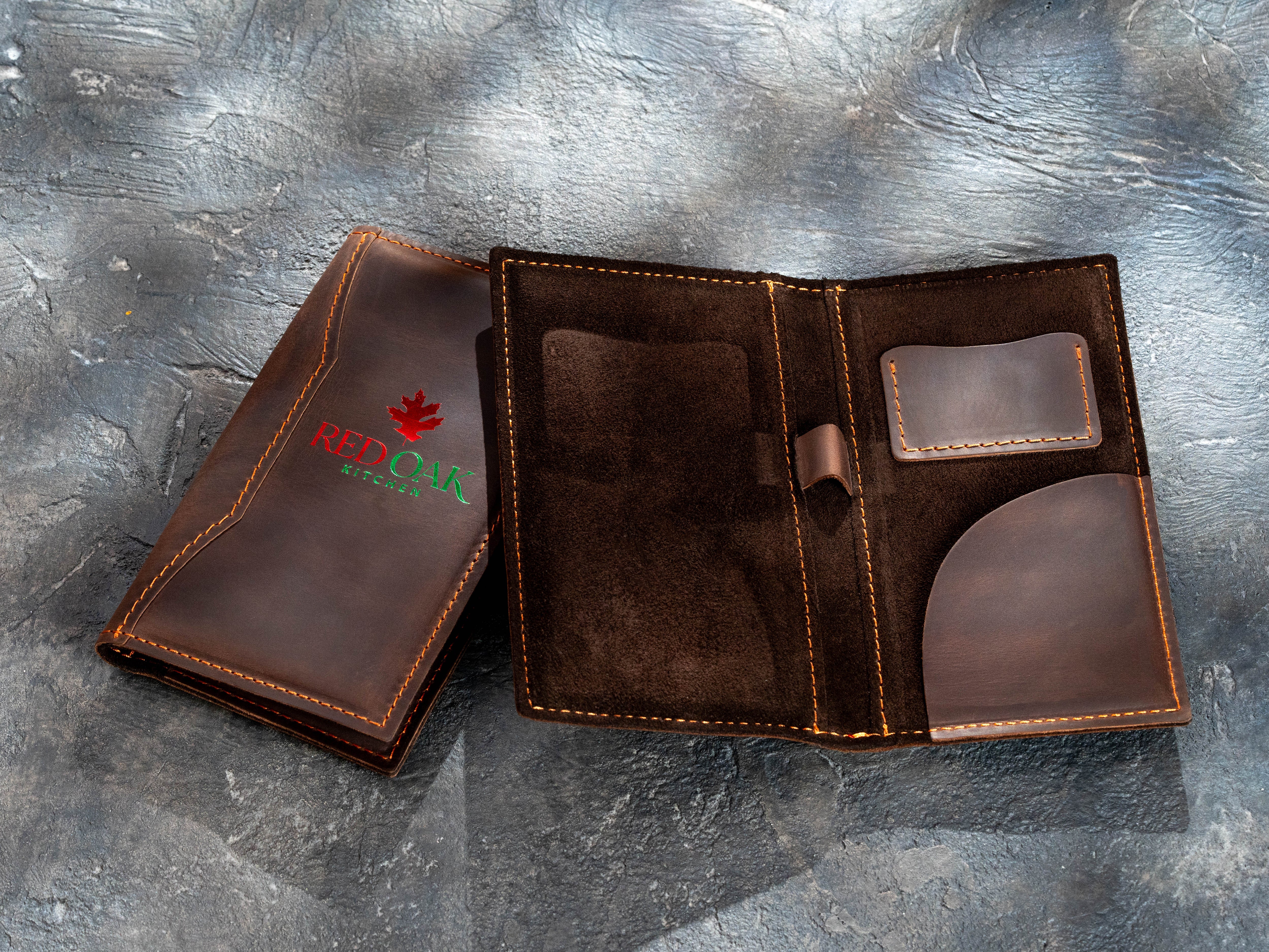 Brown leather check presenters with custom two-color red and green foil logo and interior pocket options