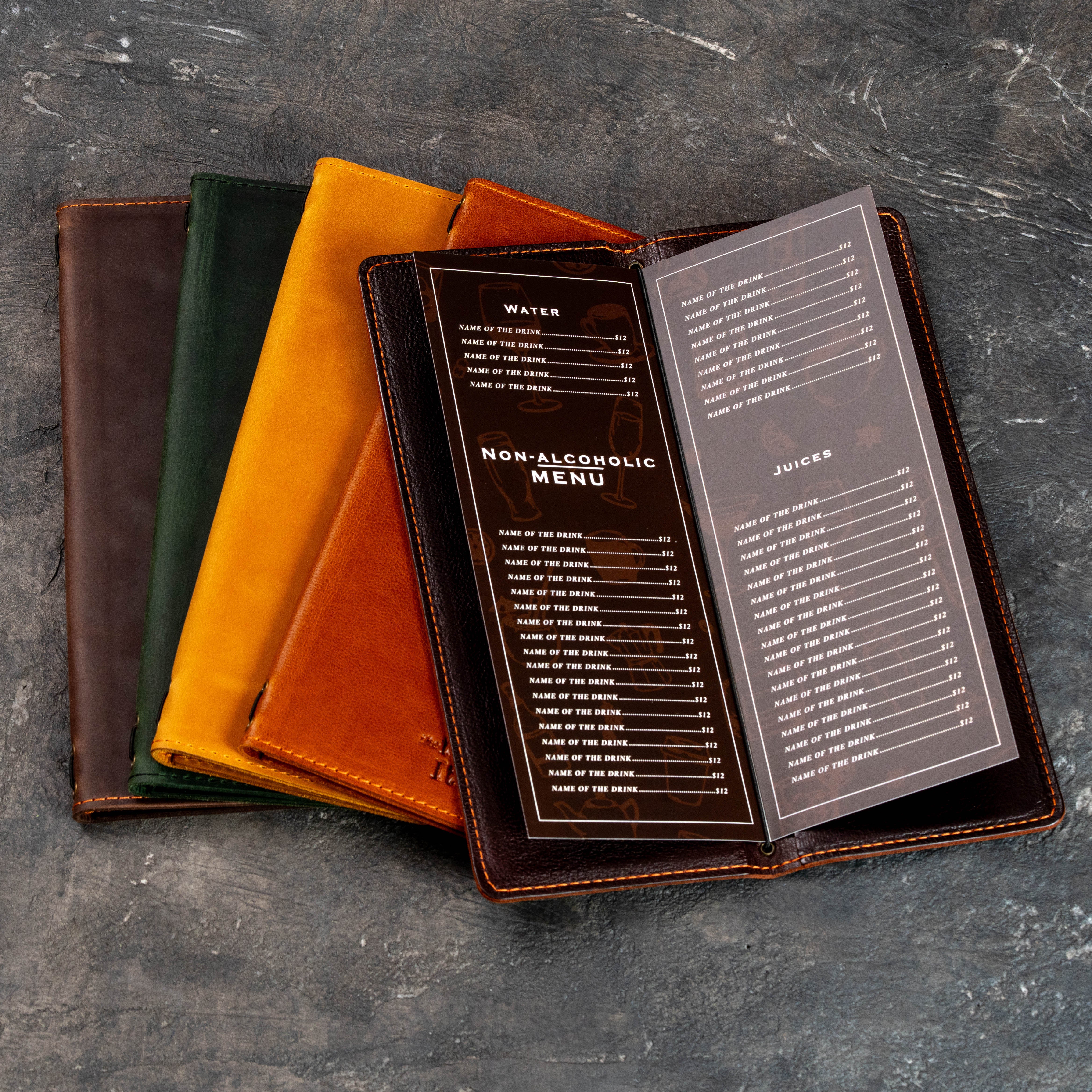 Five slim leather wine and bar menu covers in yellow, green, brown, and cognac colors