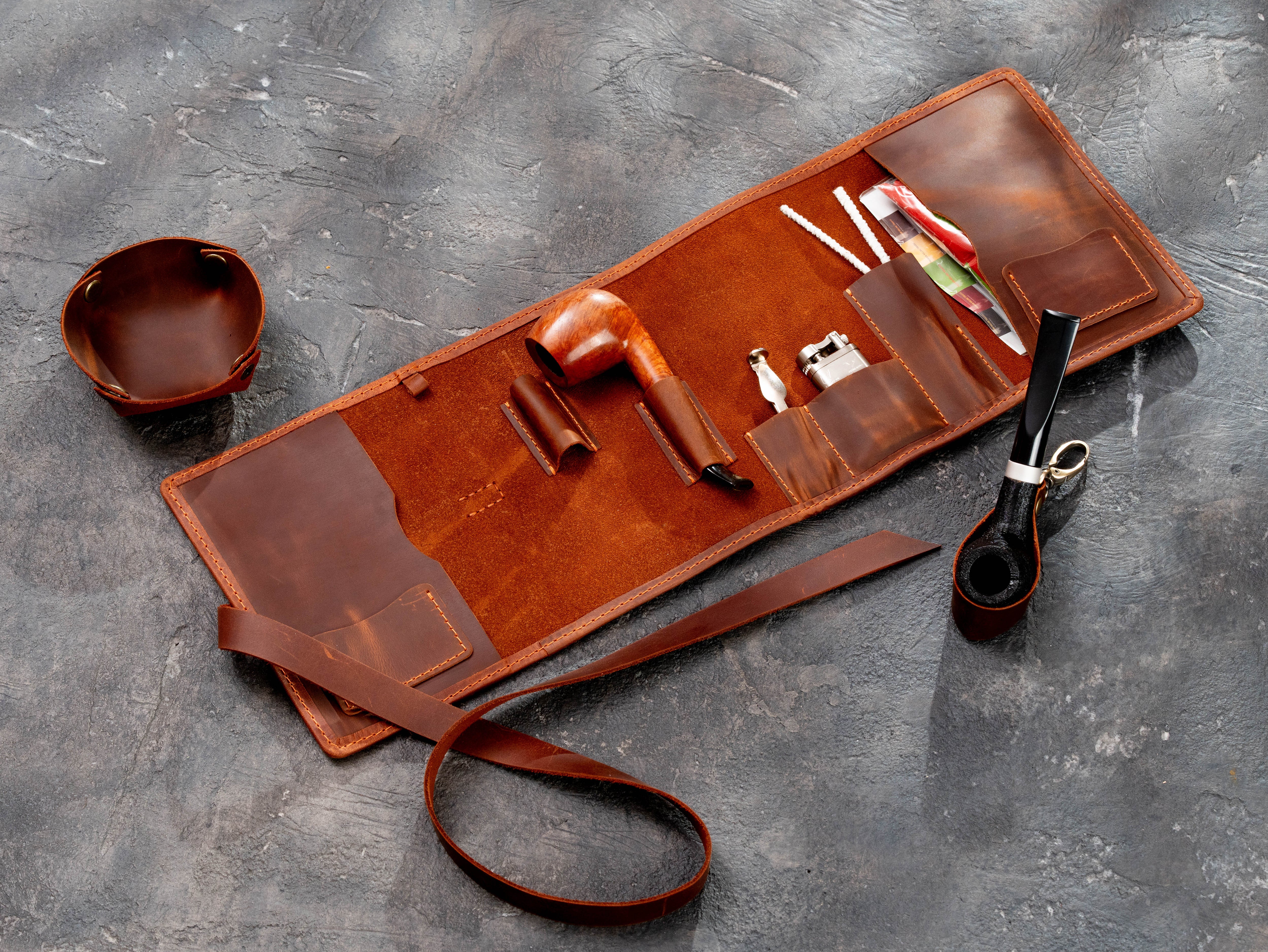 Copper leather pipe organizer displayed with smoking pipes, lighter, cleaning tools, and removable leather stand