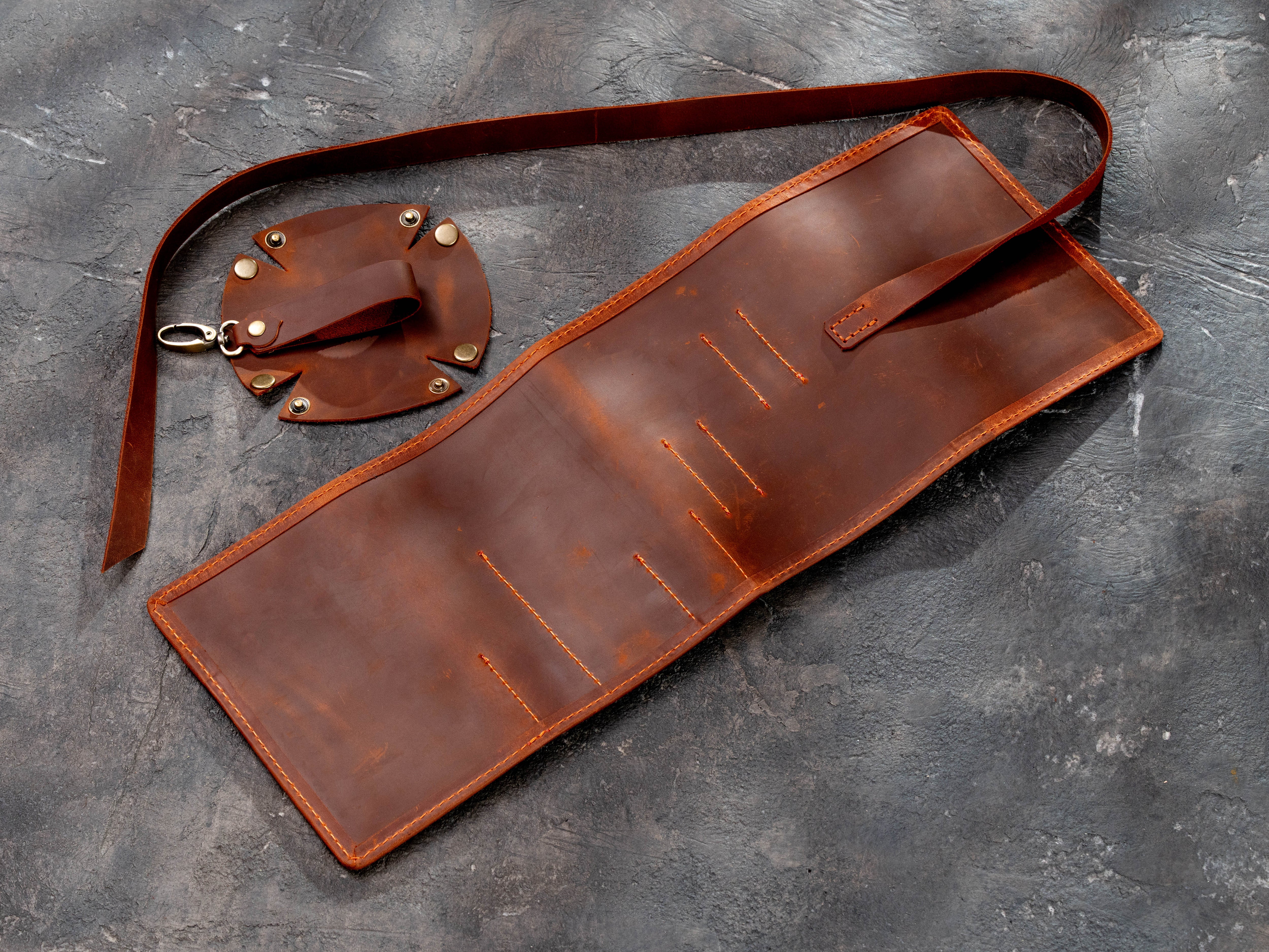Back view of the copper leather smoking pipe organizer with stitched attachment points and long strap