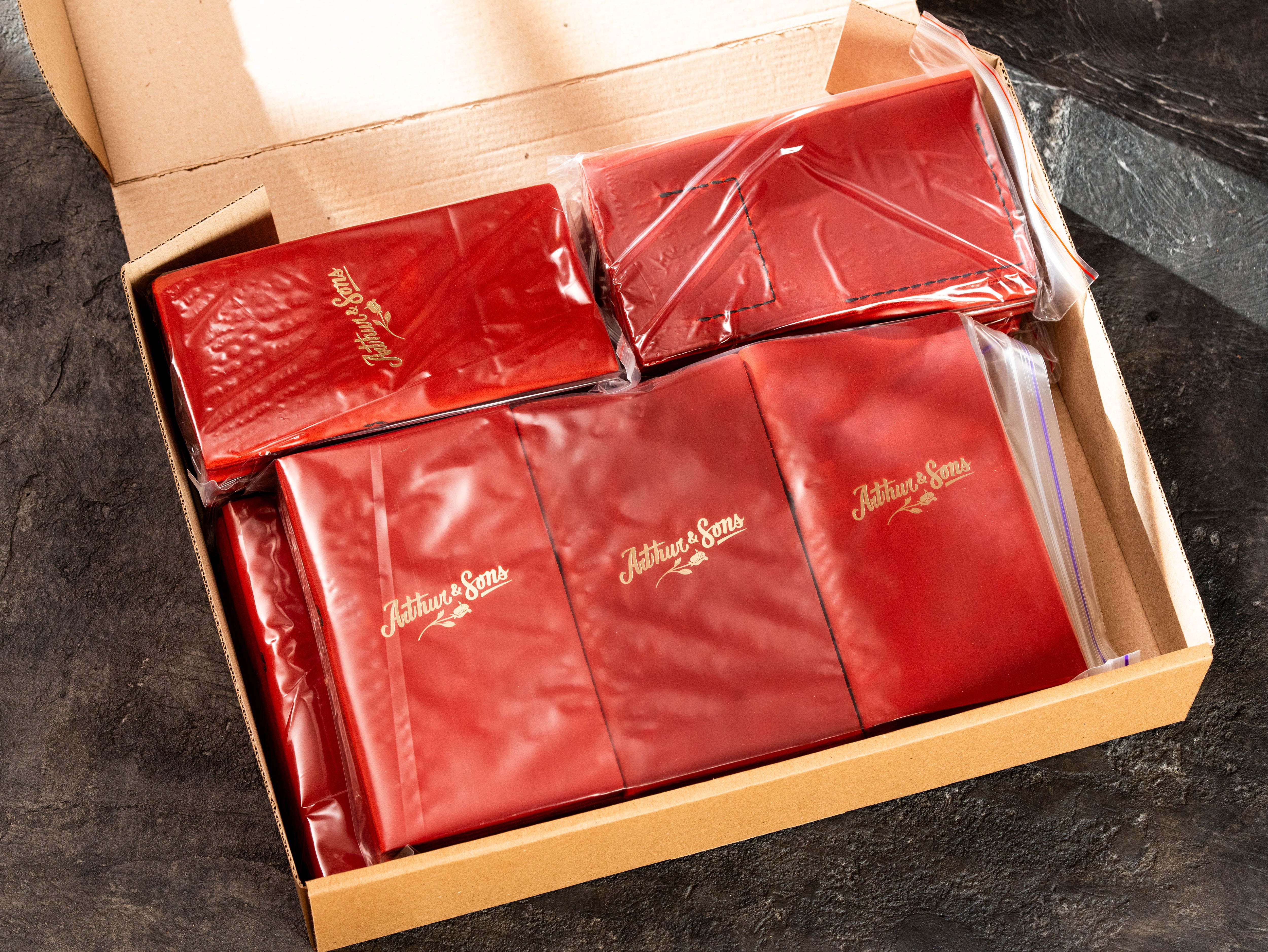 Wholesale restaurant order of red leather check presenters packed individually for shipping