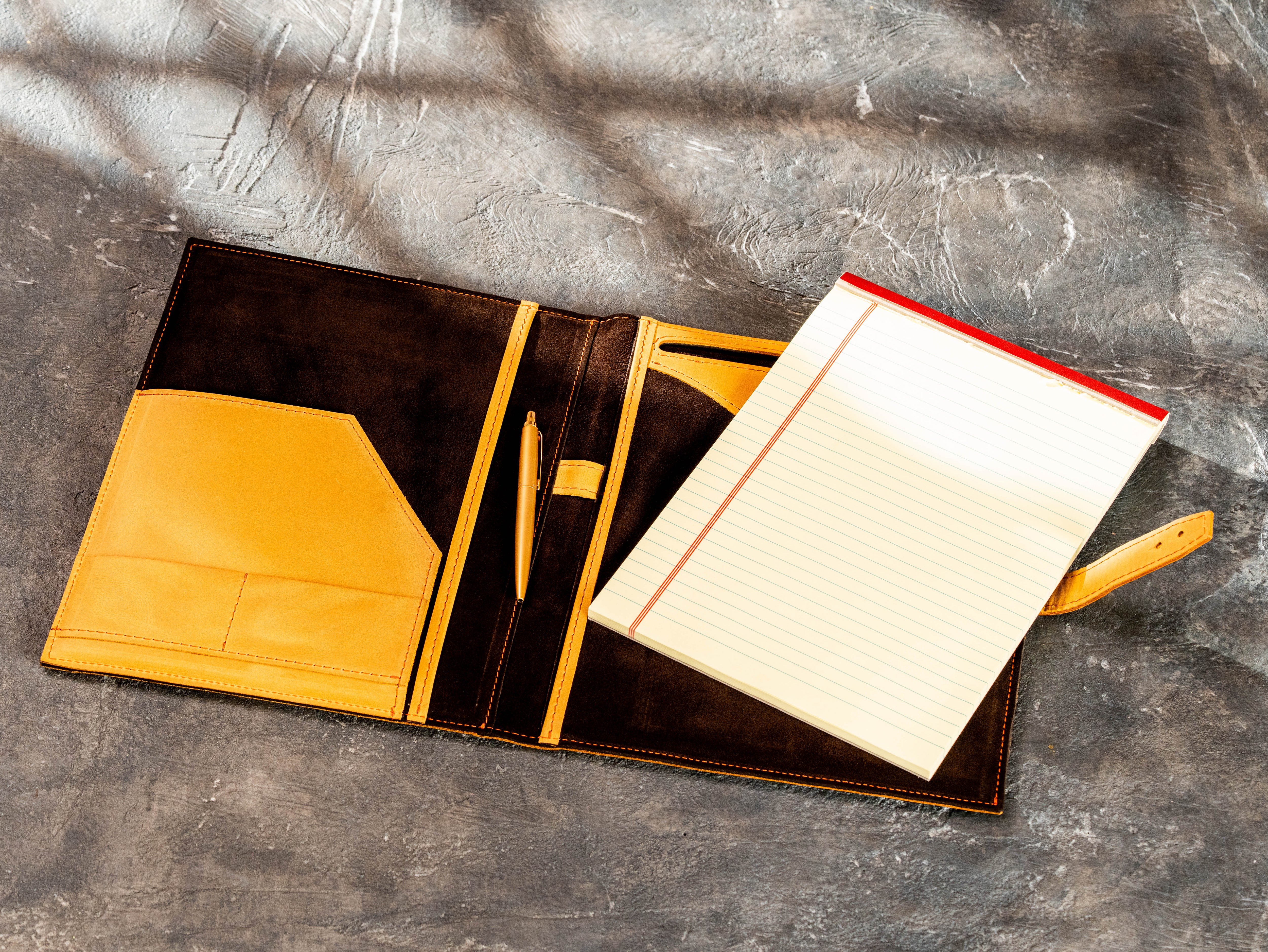 Open wheat leather portfolio with brown suede interior, document pockets and Legal Pad