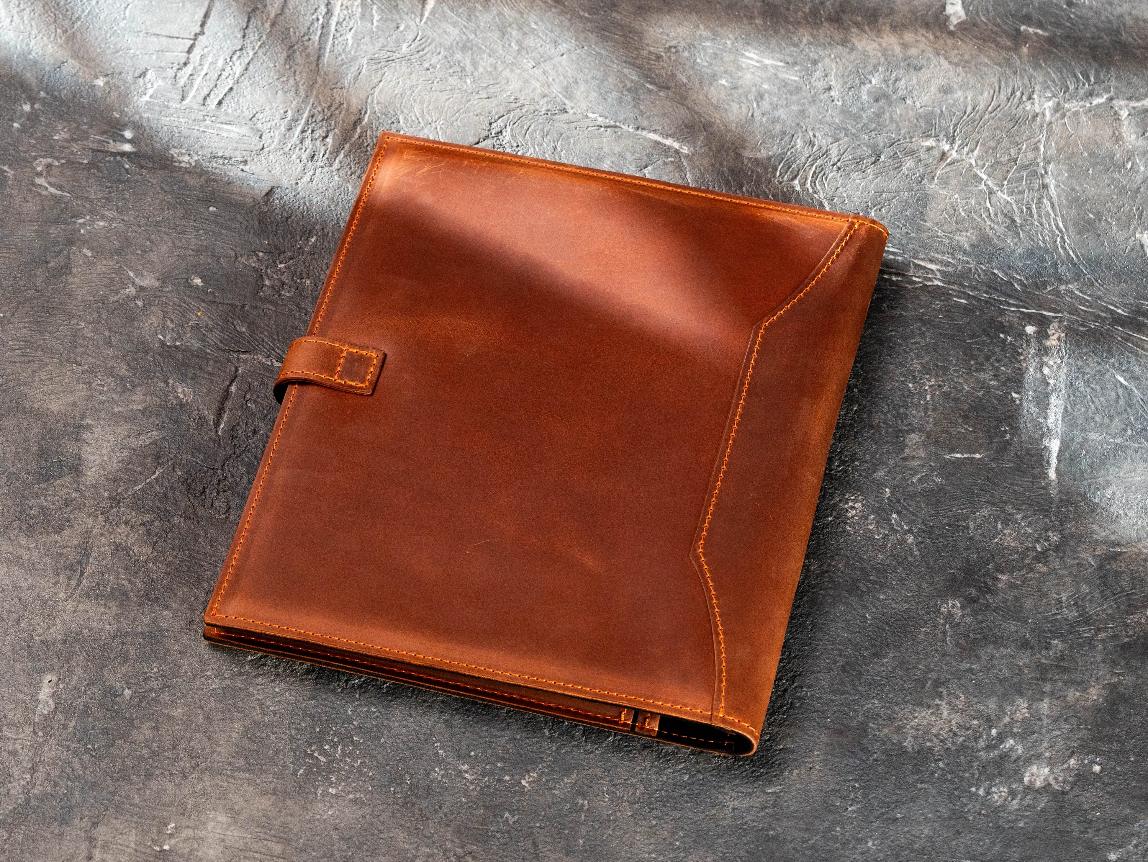 Back view of copper leather legal pad portfolio with stitched leather construction.