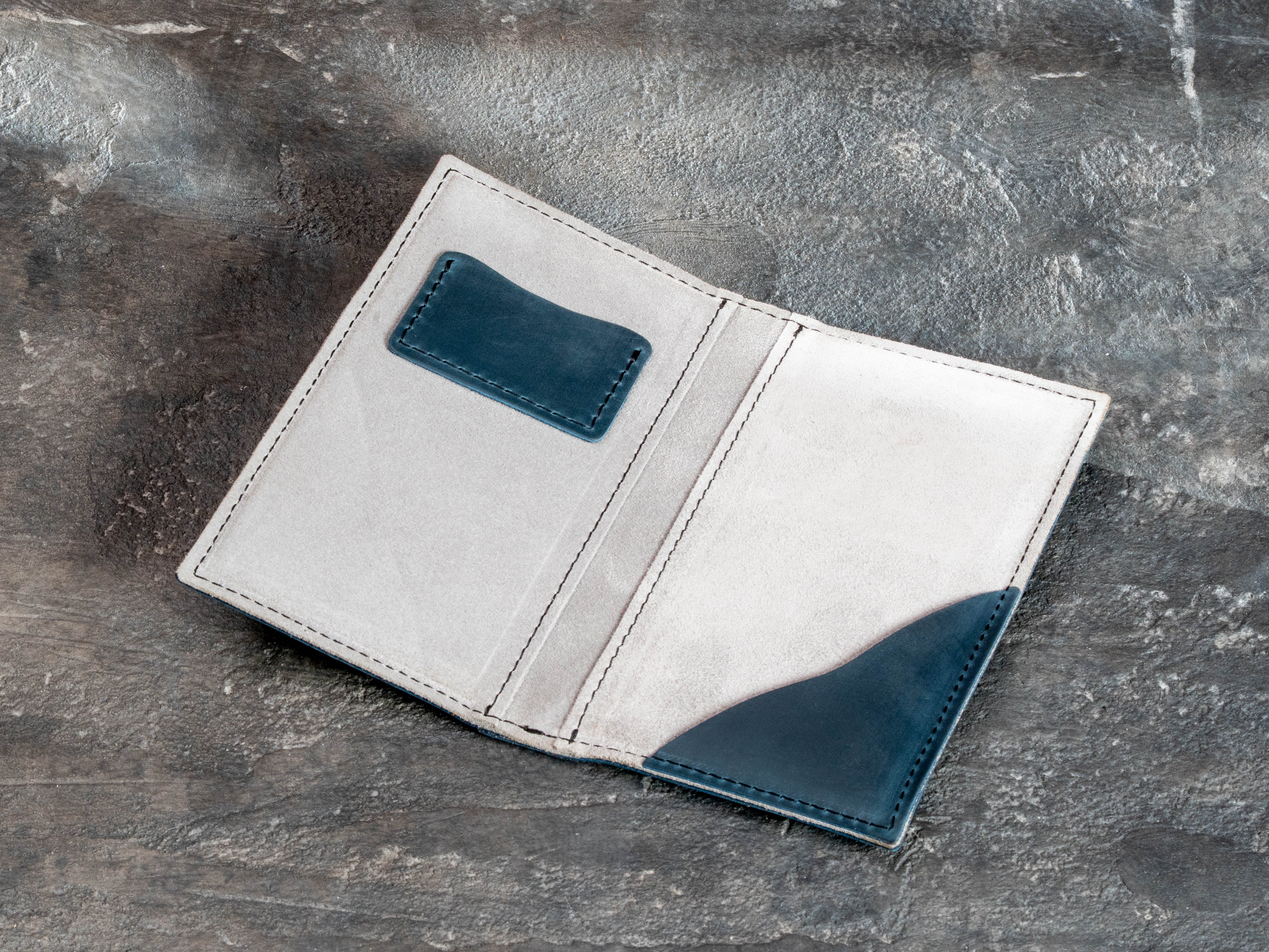Personalized deep teal leather bill holder for restaurants with custom logo, light suede lining, and organized payment pockets.