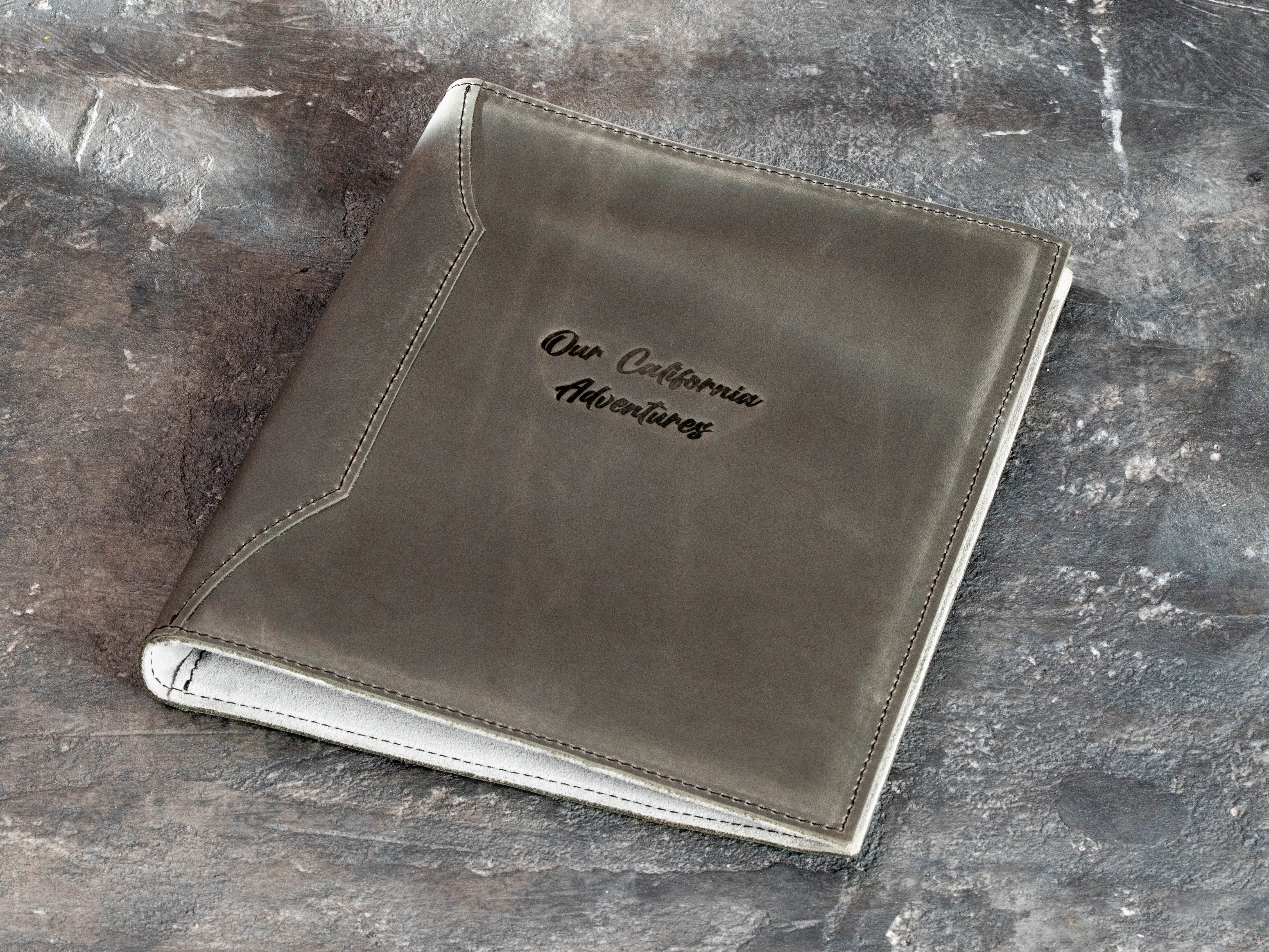 Personalized leather family memory binder with “Our California Adventures” embossing, light suede interior, and 25 mm ring mechanism