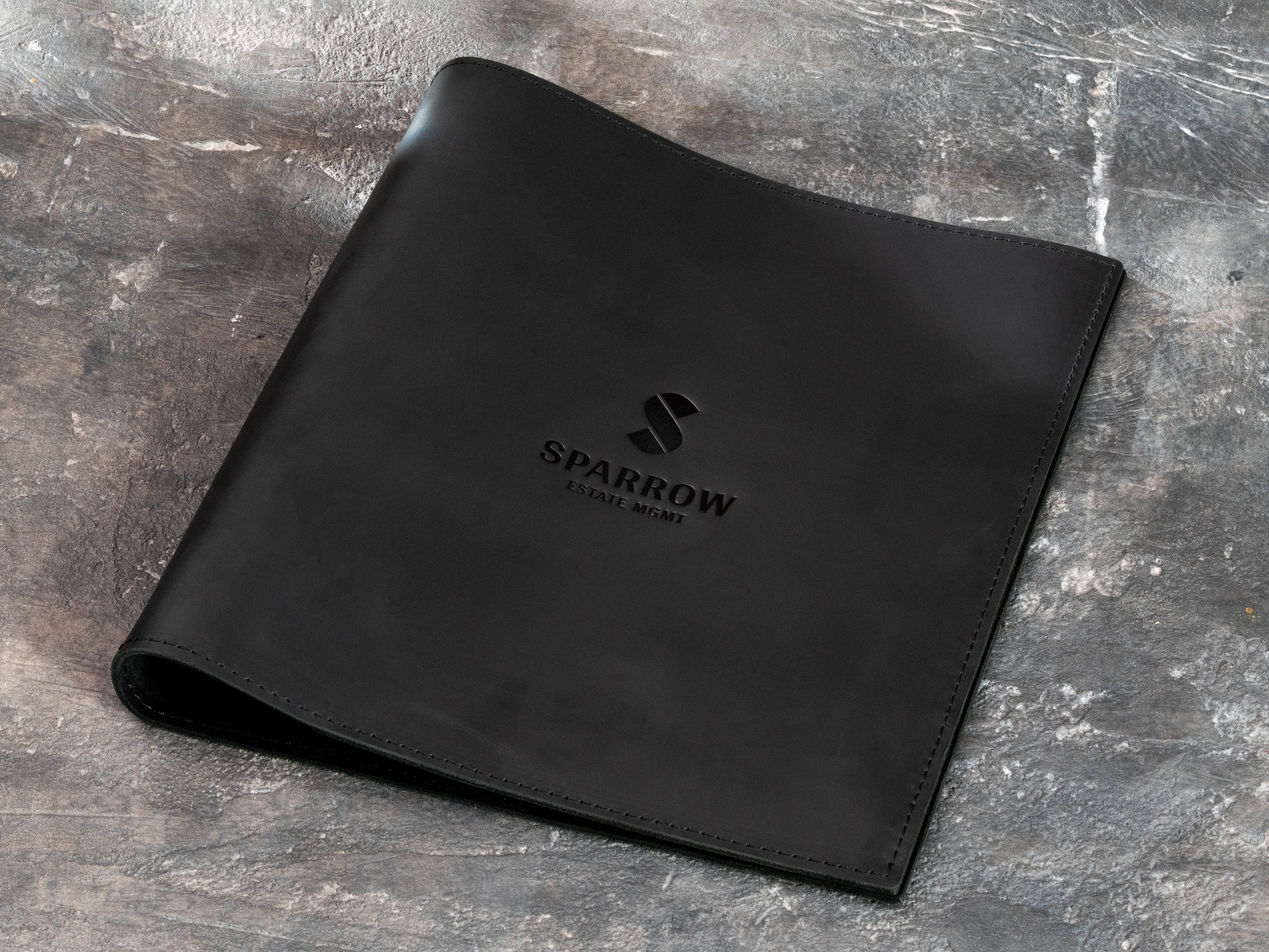 Soft black leather portfolio binder with custom client logo, designed for A4 and 8.5x11 documents
