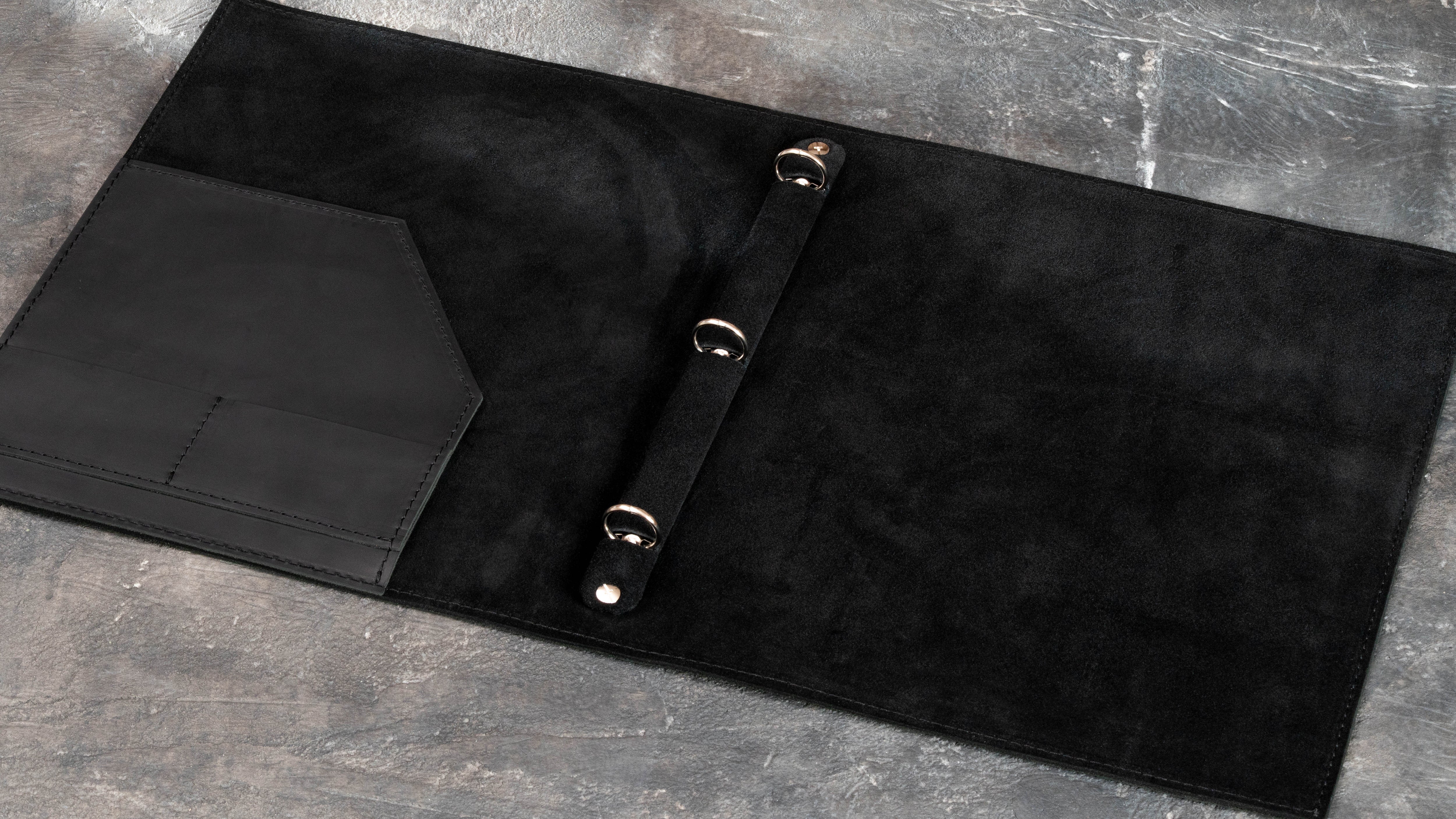 Interior view of soft leather portfolio binder with document pocket and 20 mm three-ring holder