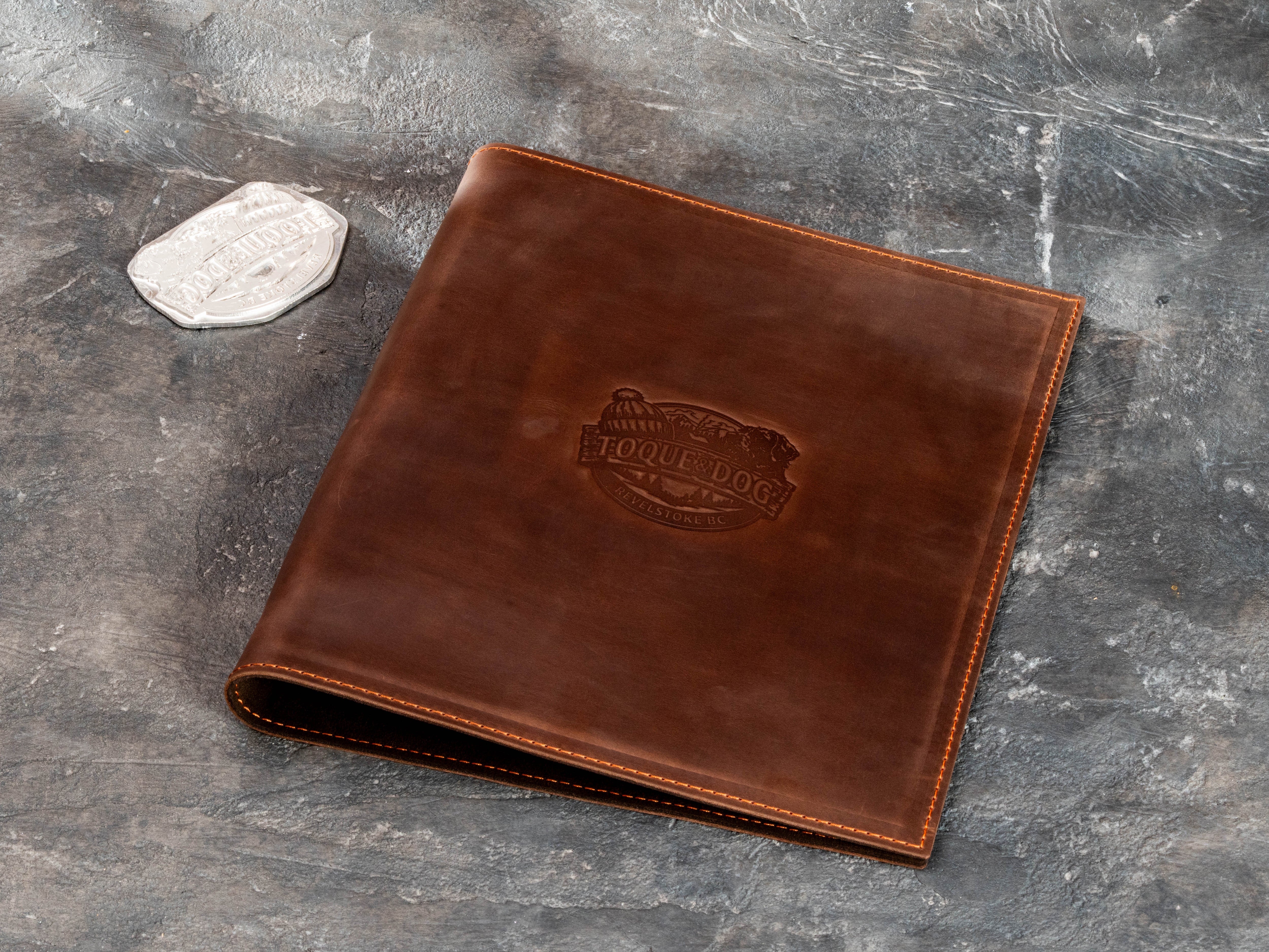 Brown leather guest welcome binder for A4 and 8.5x11 travel information and hospitality documents