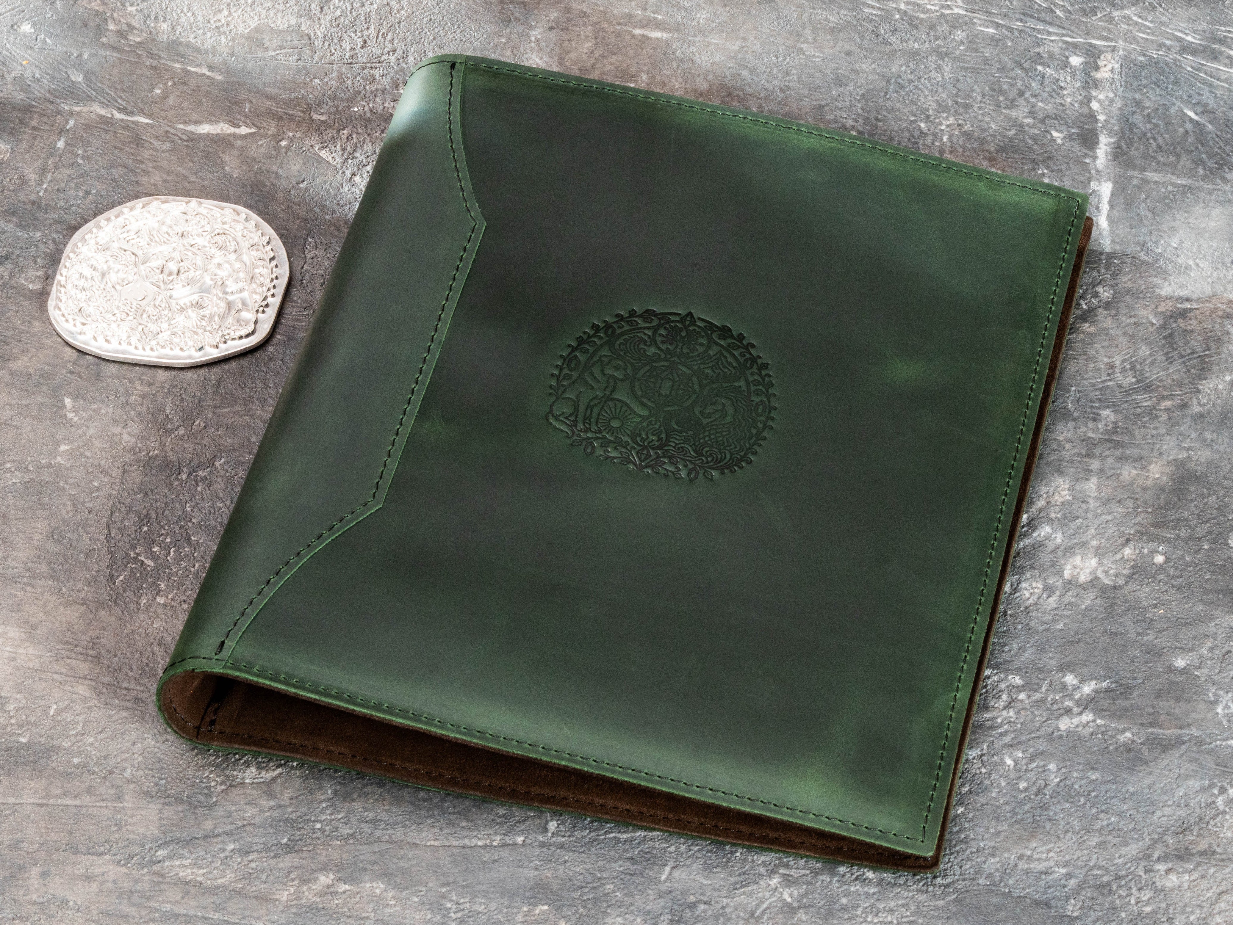 Green leather childhood memory binder with custom artistic embossing and matching embossing die