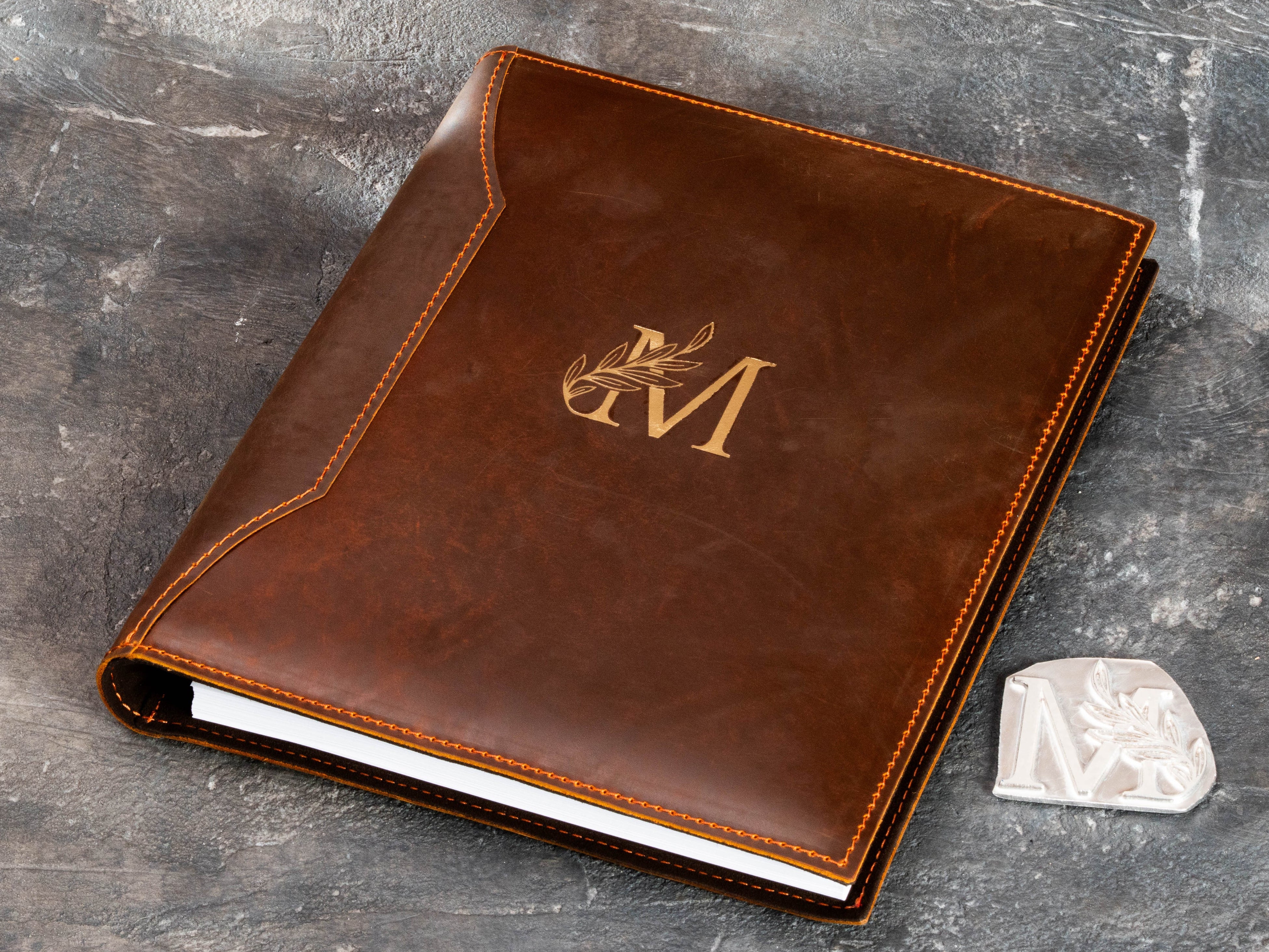 Chestnut brown leather keepsake binder with custom gold monogram and personalized design