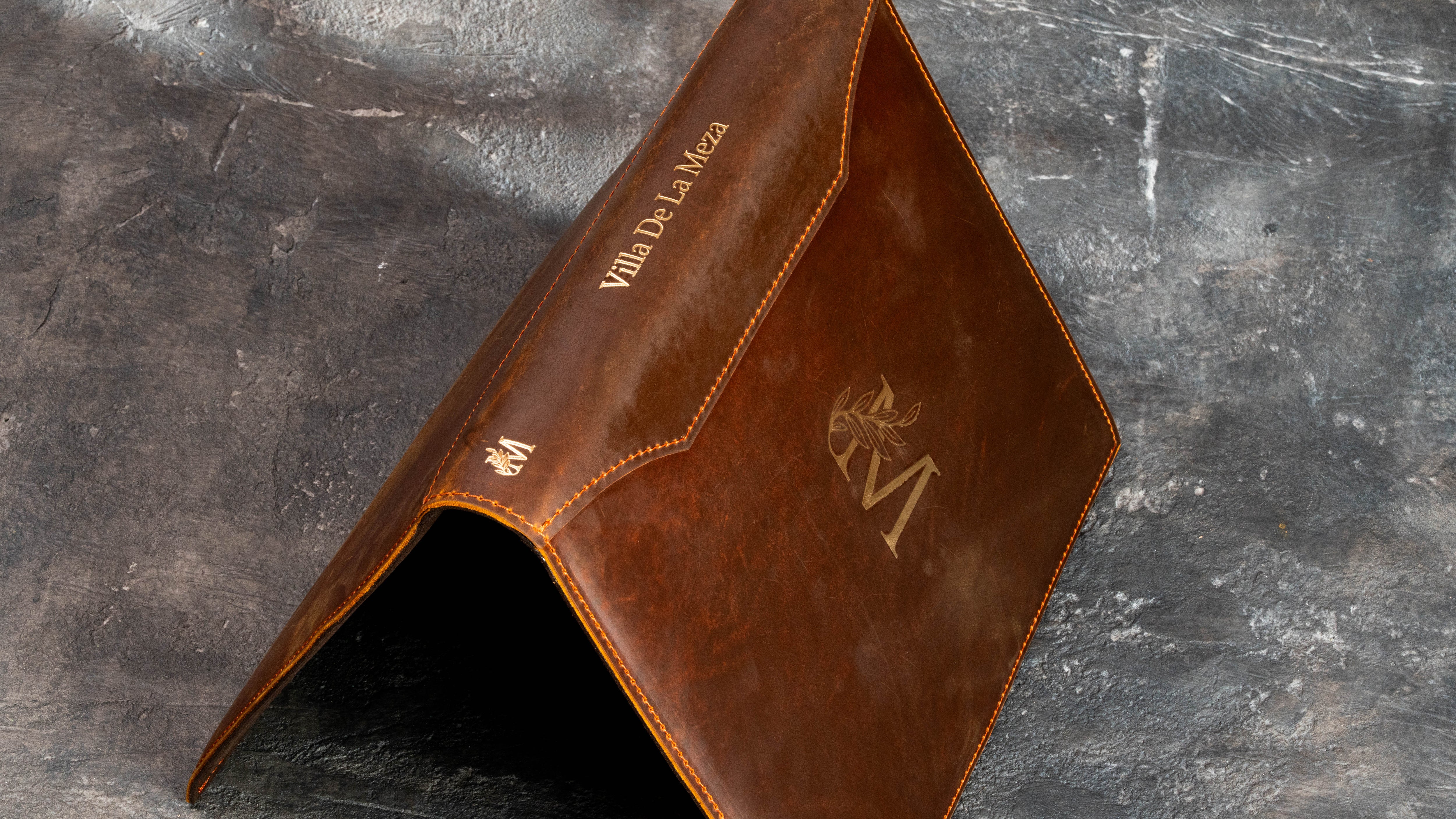 Leather keepsake binder with gold monogram and custom personalization on the spine