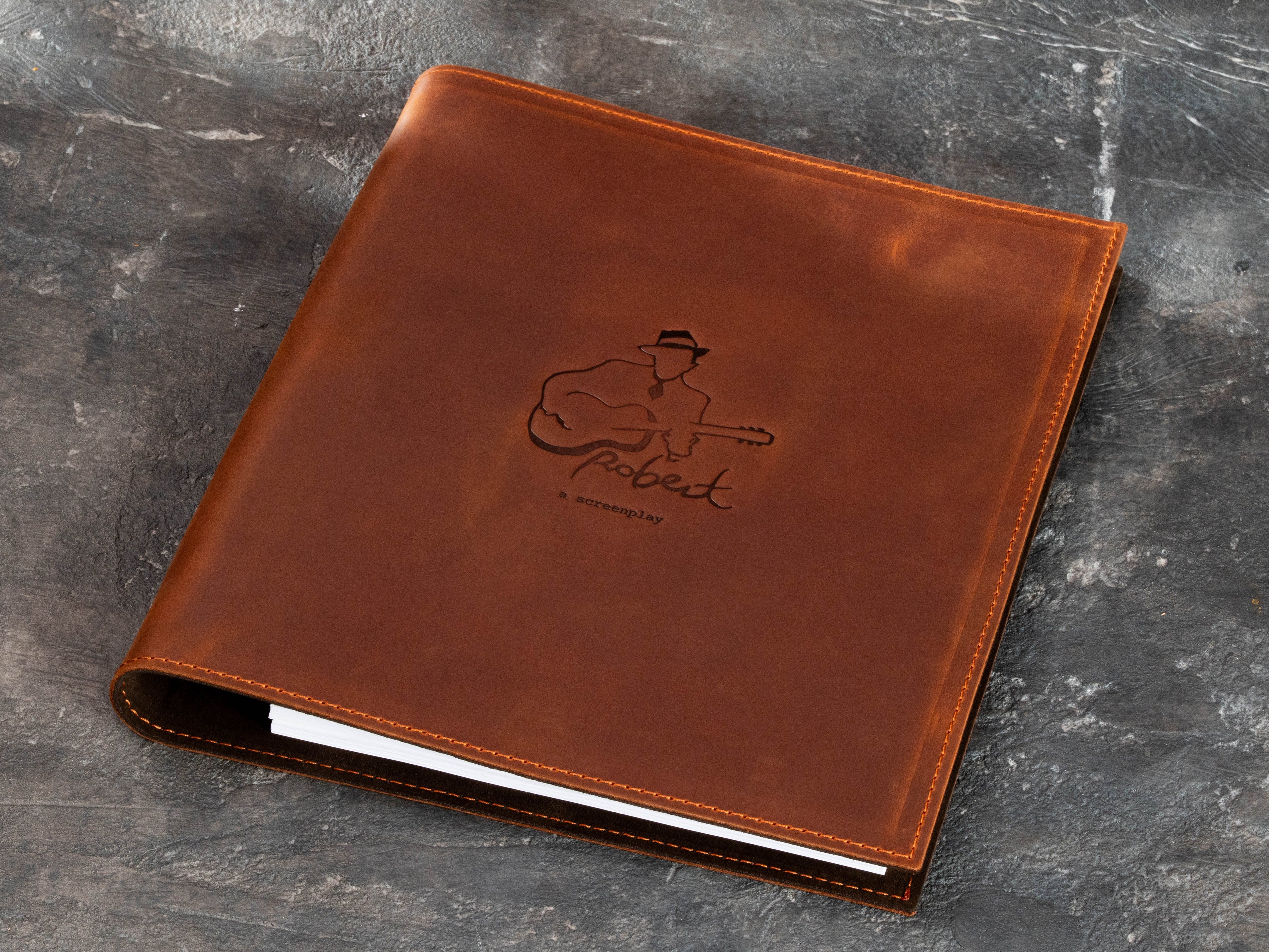 Brown leather sheet music binder for scores, lyrics, chord charts and creative projects with custom musician design