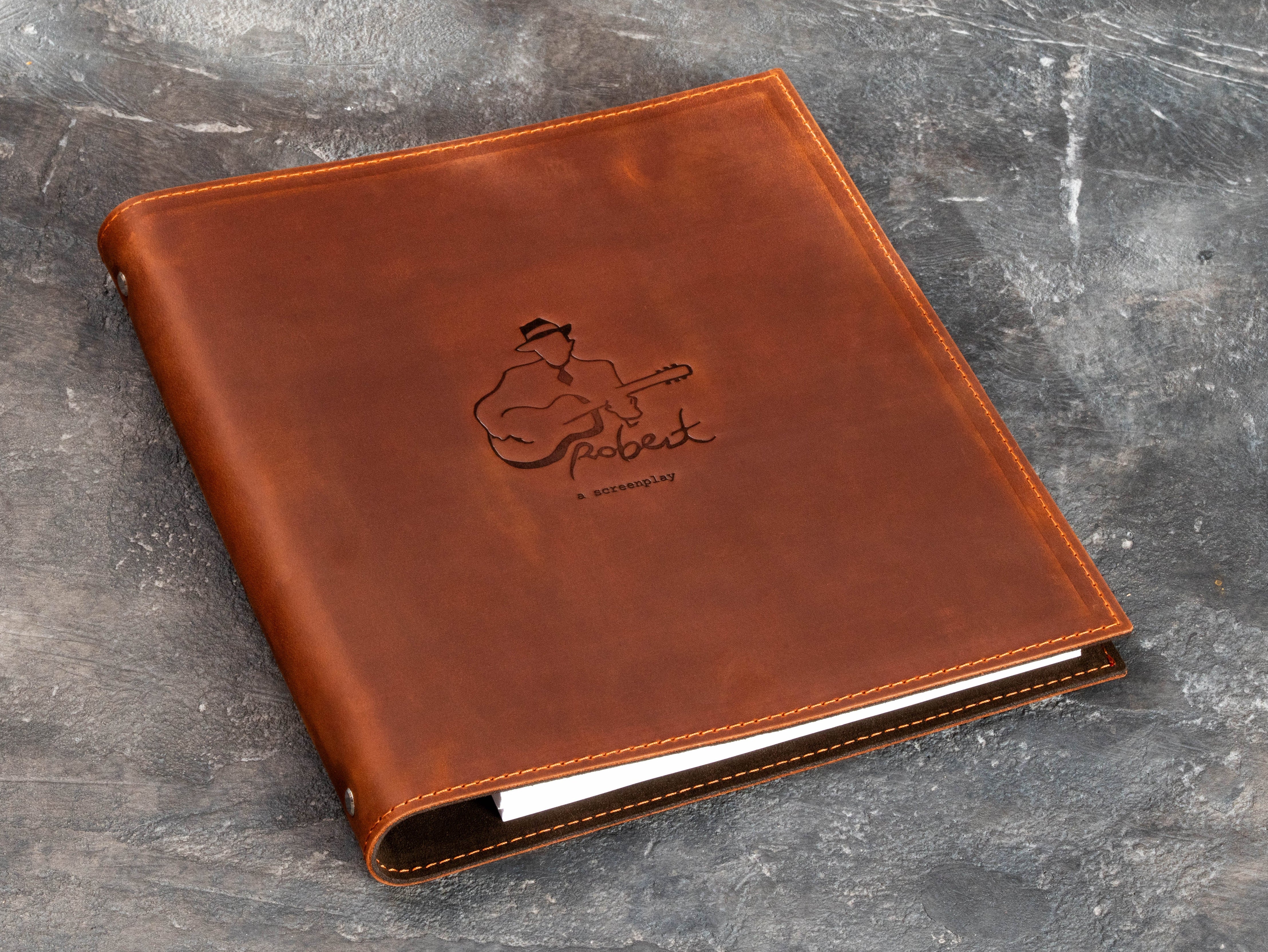 Personalized leather screenplay and music project binder with guitar artwork, stitched edges and custom embossed cover